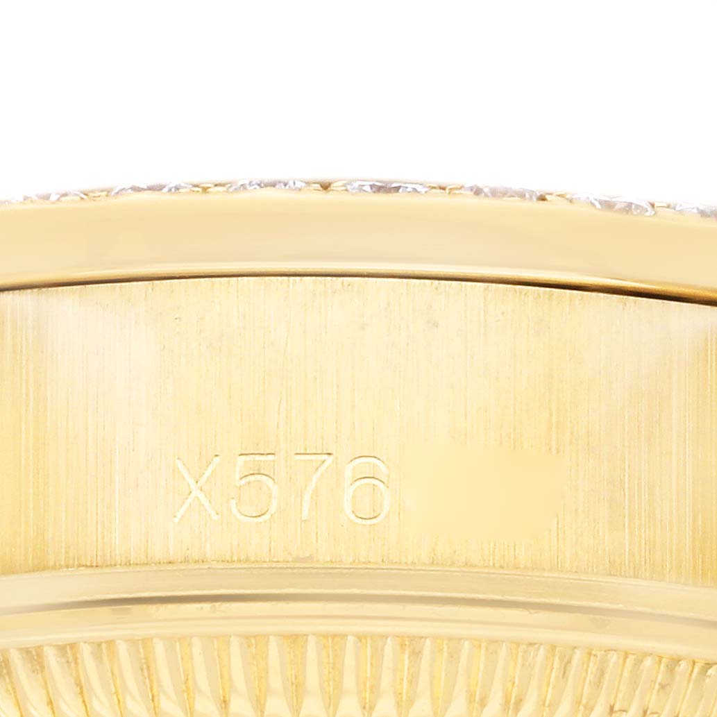 This image shows a close-up side view of the case with a serial number of a Rolex President 69158 Women's Yellow Gold Champagne Dial 69158 Women's Yellow Gold Champagne Dial model watch.