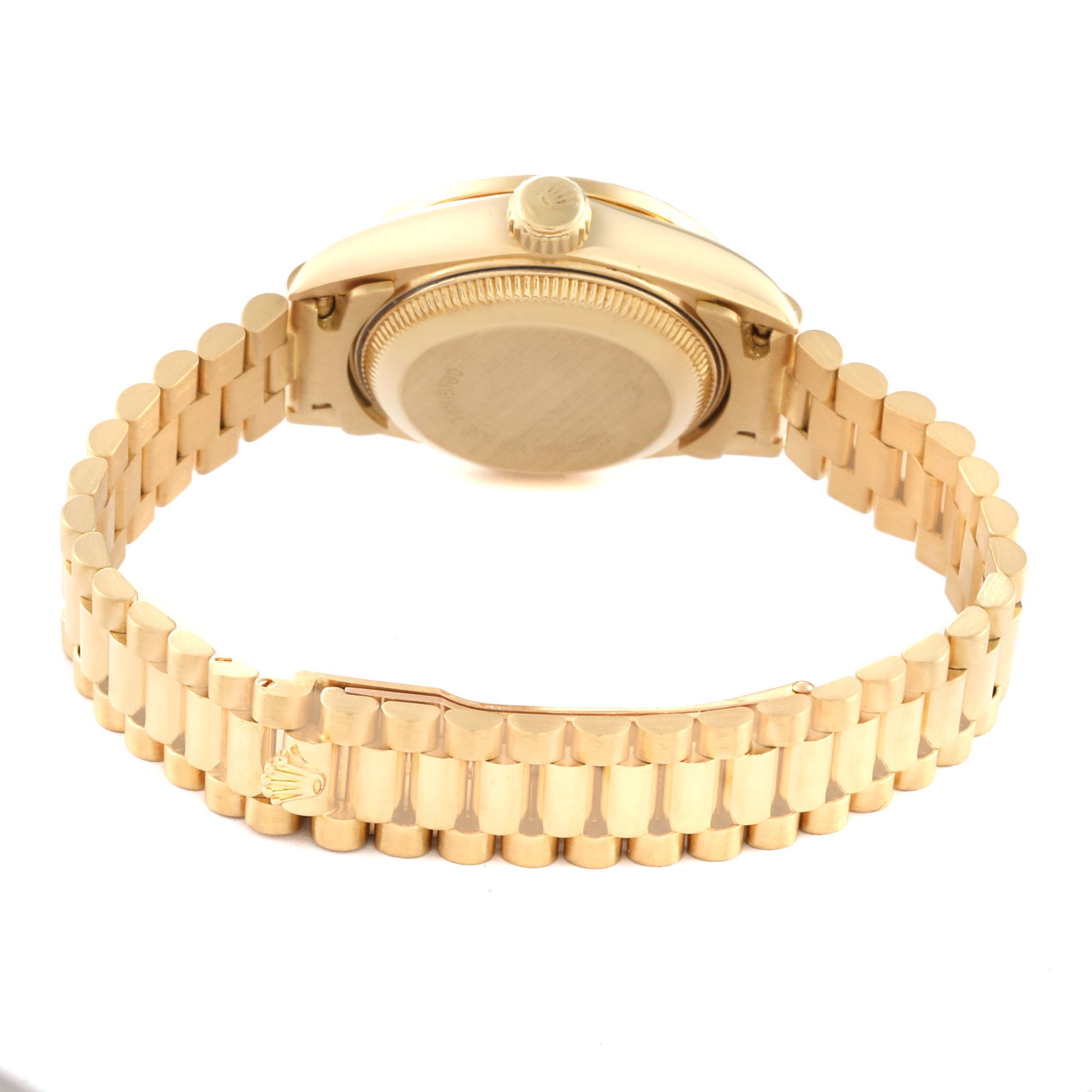 The image shows the backside of a Rolex President 69158 Women's Yellow Gold Champagne Dial 69158 Women's Yellow Gold Champagne Dial model watch, highlighting the case back, crown, and part of the bracelet.