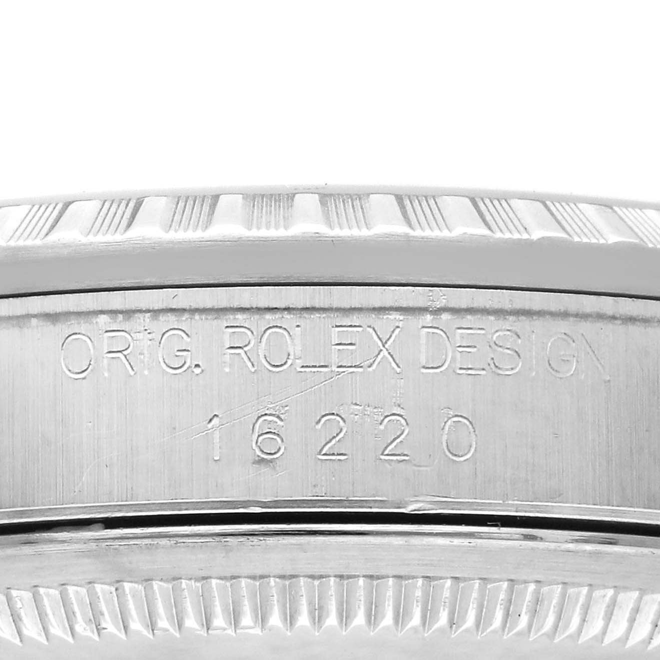 This image shows the side angle of a Rolex Datejust 16220 Men's Stainless Steel Silver Dial 16220 Men's Stainless Steel Silver Dial watch case, displaying the engraving "ORIG ROLEX DESIGN" with model number "16220."