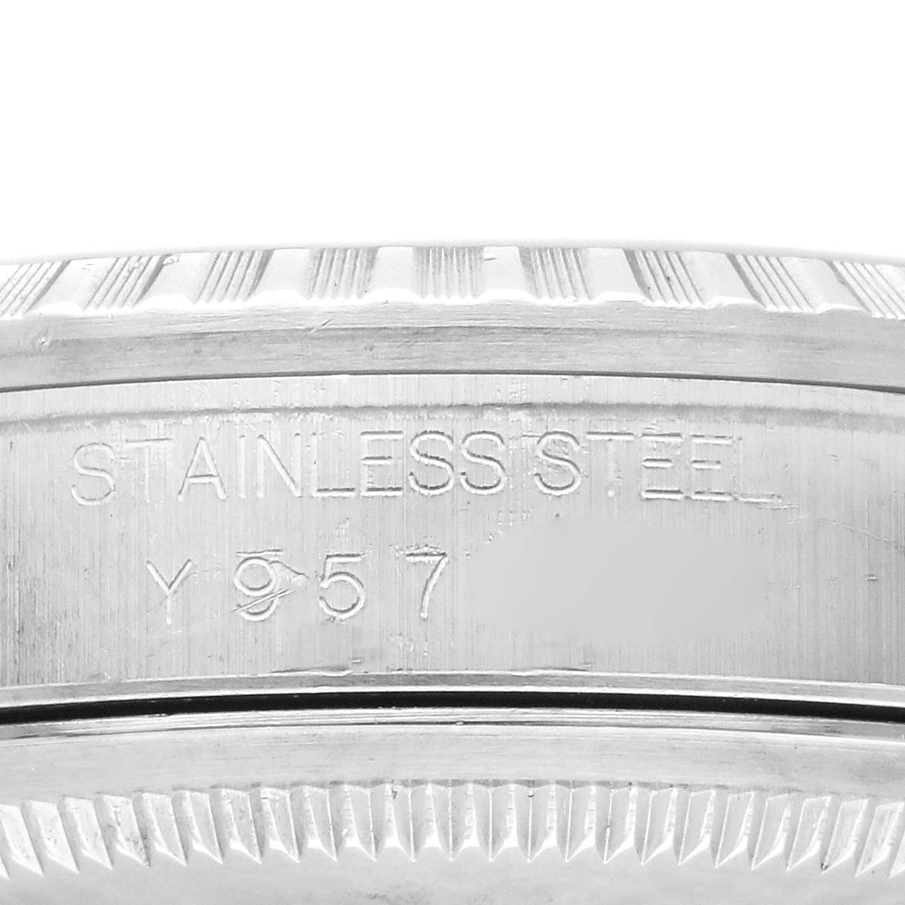 The image shows a close-up angle of the engravings on the side of the case of a Rolex Datejust 16220 Men's Stainless Steel Silver Dial 16220 Men's Stainless Steel Silver Dial watch, highlighting the "STAINLESS STEEL" marking.