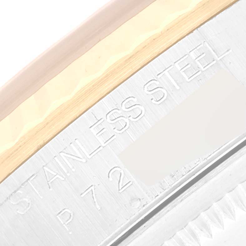 The image shows a close-up of the stainless steel bezel on a Rolex Datejust 16233 Men's Steel and Gold (two tone) Champagne Dial 16233 Men's Steel and Gold (two tone) Champagne Dial watch.