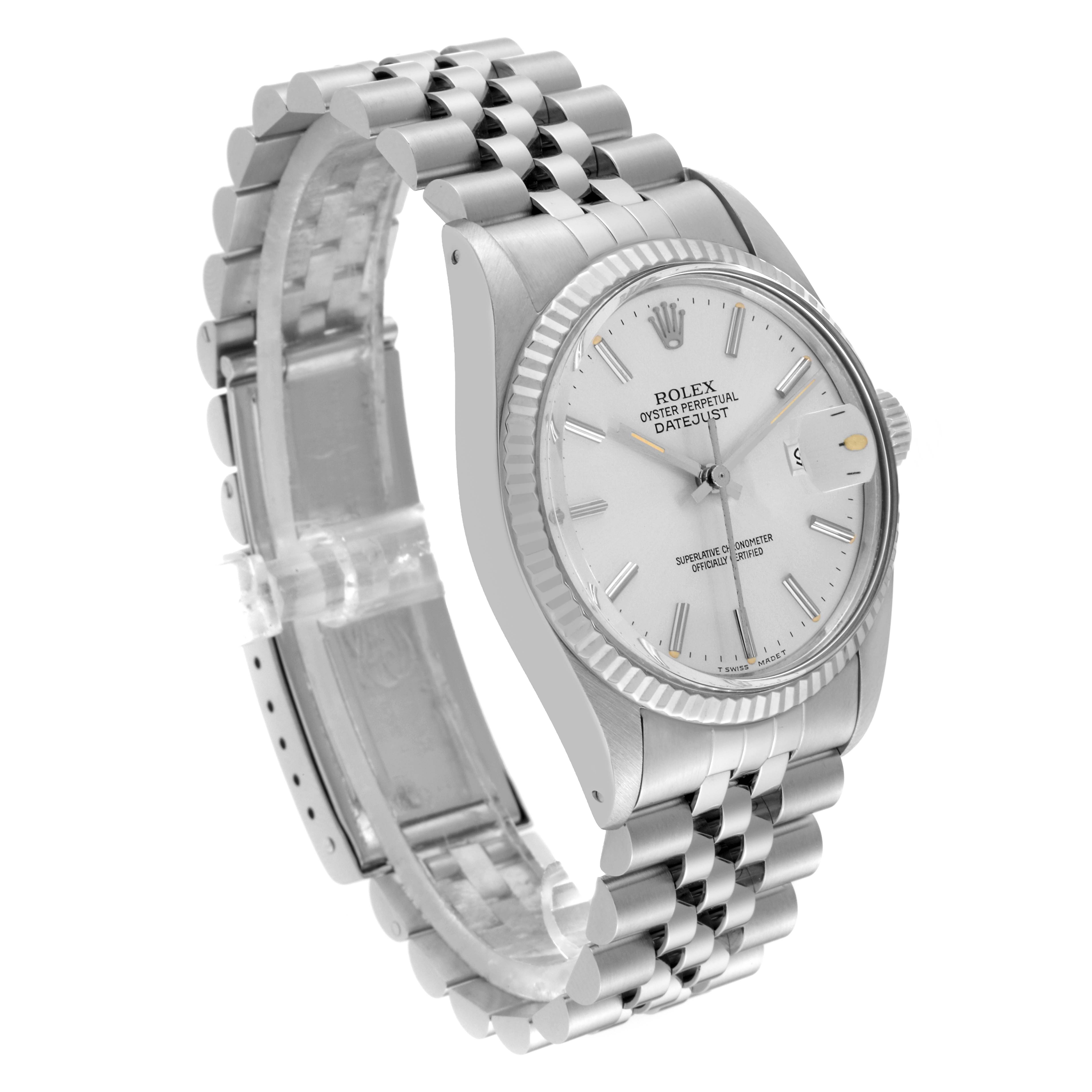 The Rolex Datejust 16014 Men's Stainless Steel Silver Dial 16014 Men's Stainless Steel Silver Dial watch is shown from a three-quarter angle, displaying its face, fluted bezel, and jubilee bracelet.