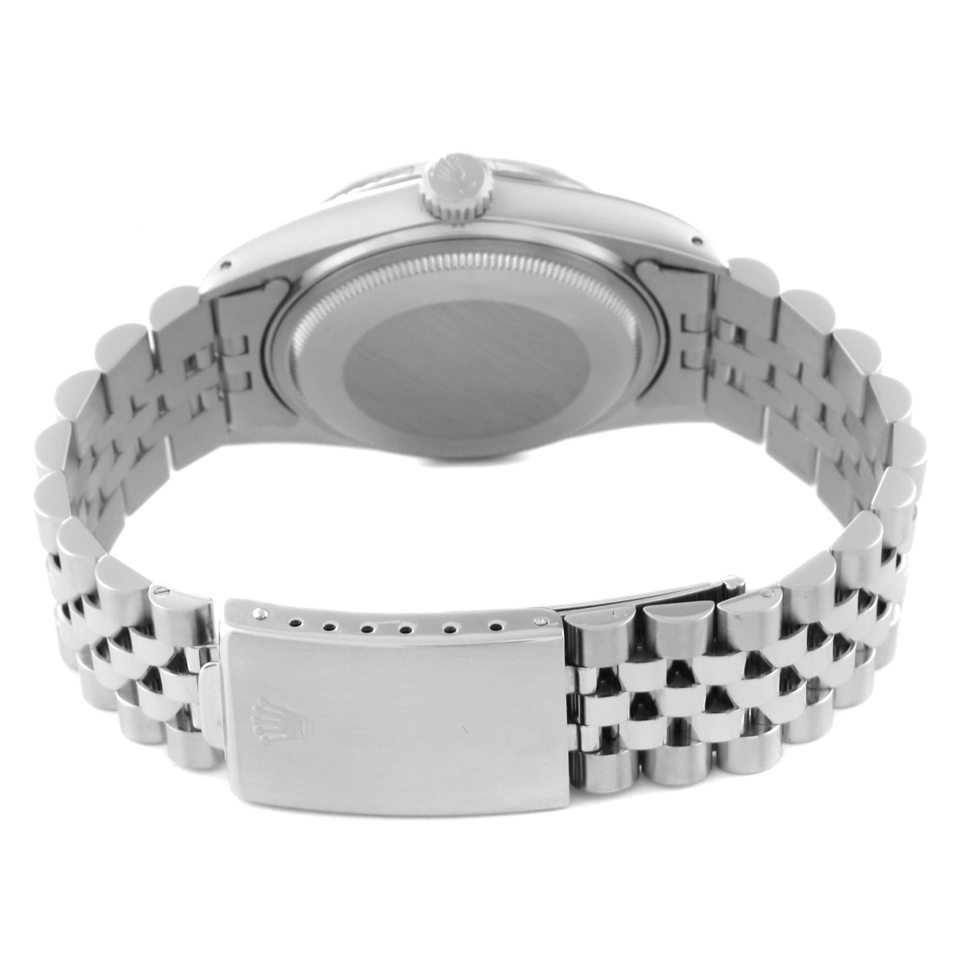 This image shows the back view of a Rolex Datejust 16014 Men's Stainless Steel Silver Dial 16014 Men's Stainless Steel Silver Dial watch, focusing on the case back and the bracelet with its clasp.