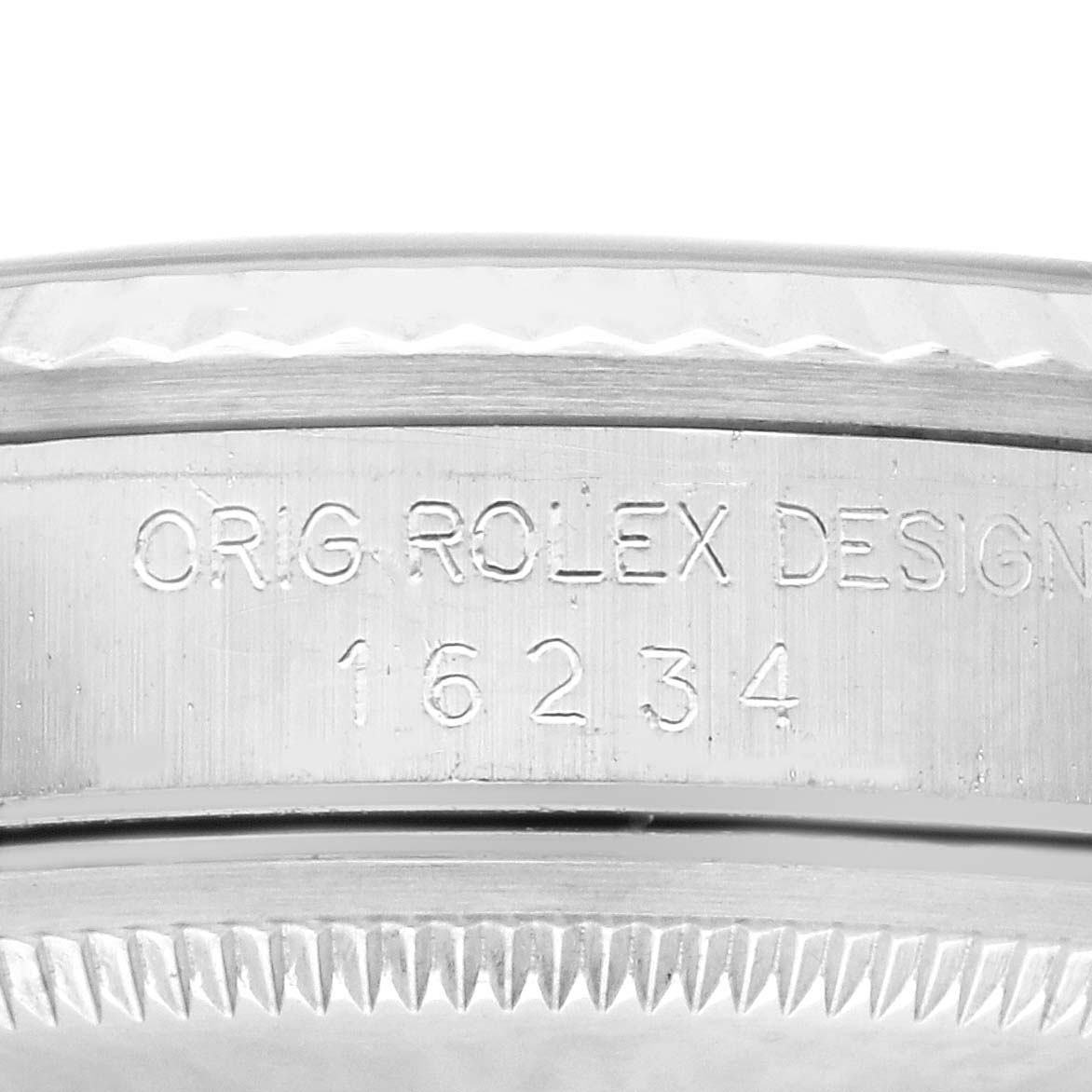This image shows an angled close-up of the side of the bezel and casing of a Rolex Datejust 16234 Men's Stainless Steel Silver Dial 16234 Men's Stainless Steel Silver Dial, highlighting the "Orig Rolex Design 16234" engraving.