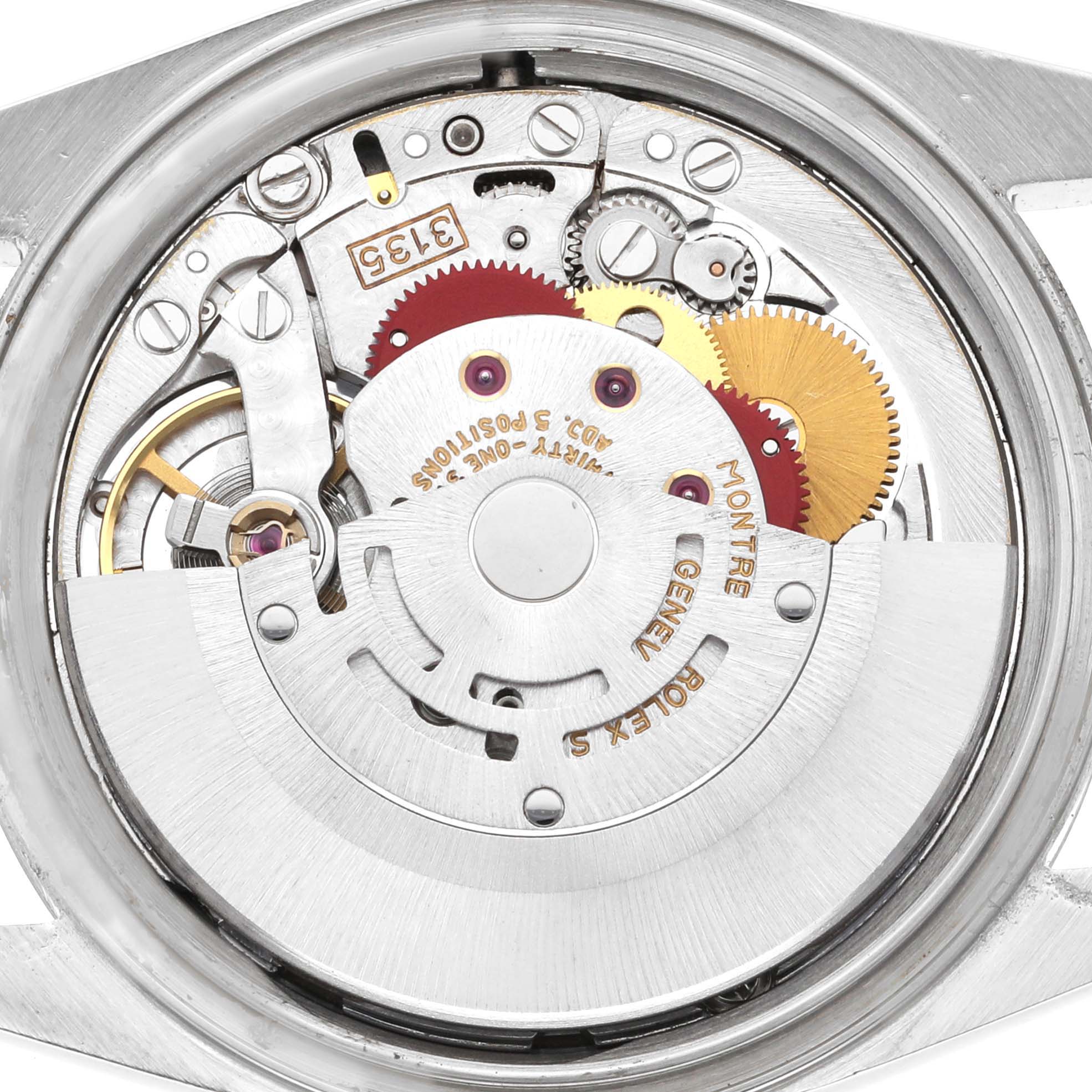 The image shows a close-up of the movement and internal mechanics of a Rolex Datejust 16234 Men's Stainless Steel Silver Dial 16234 Men's Stainless Steel Silver Dial watch, highlighting gears and rotors.