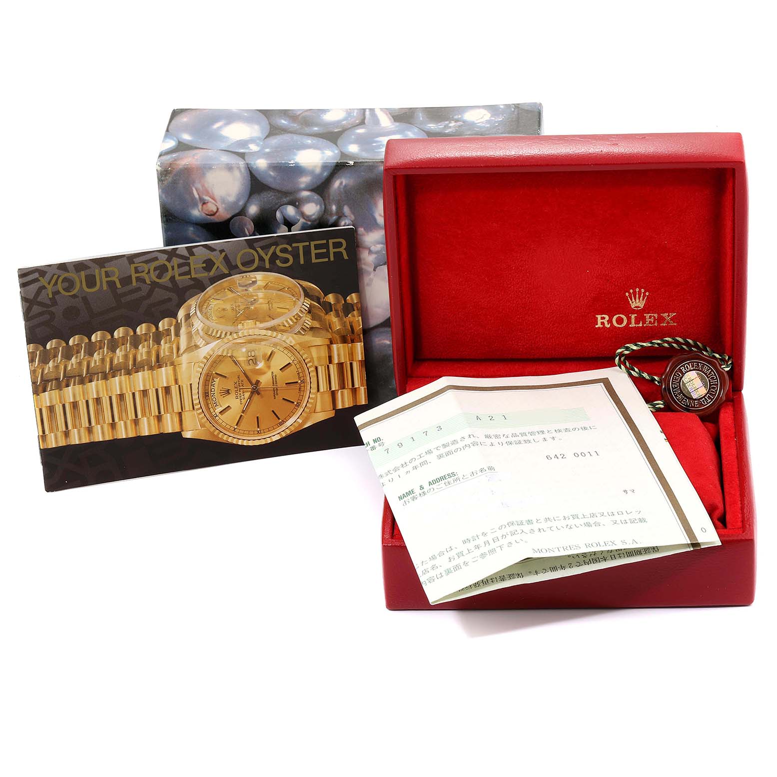 This image shows a Rolex Datejust 79173  Women
s Steel and Gold (two tone) Champagne Dial 79173  Women
s Steel and Gold (two tone) Champagne Dial model box, warranty papers, and a booklet.