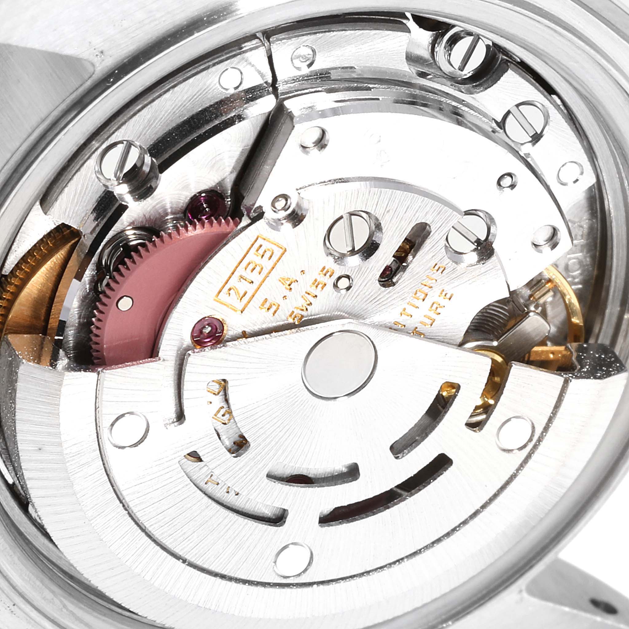 This image shows the intricate movement mechanism of a Rolex Datejust 69173 Women
s Steel and Gold (two tone) Champagne Dial 69173 Women
s Steel and Gold (two tone) Champagne Dial watch from a close-up angle.