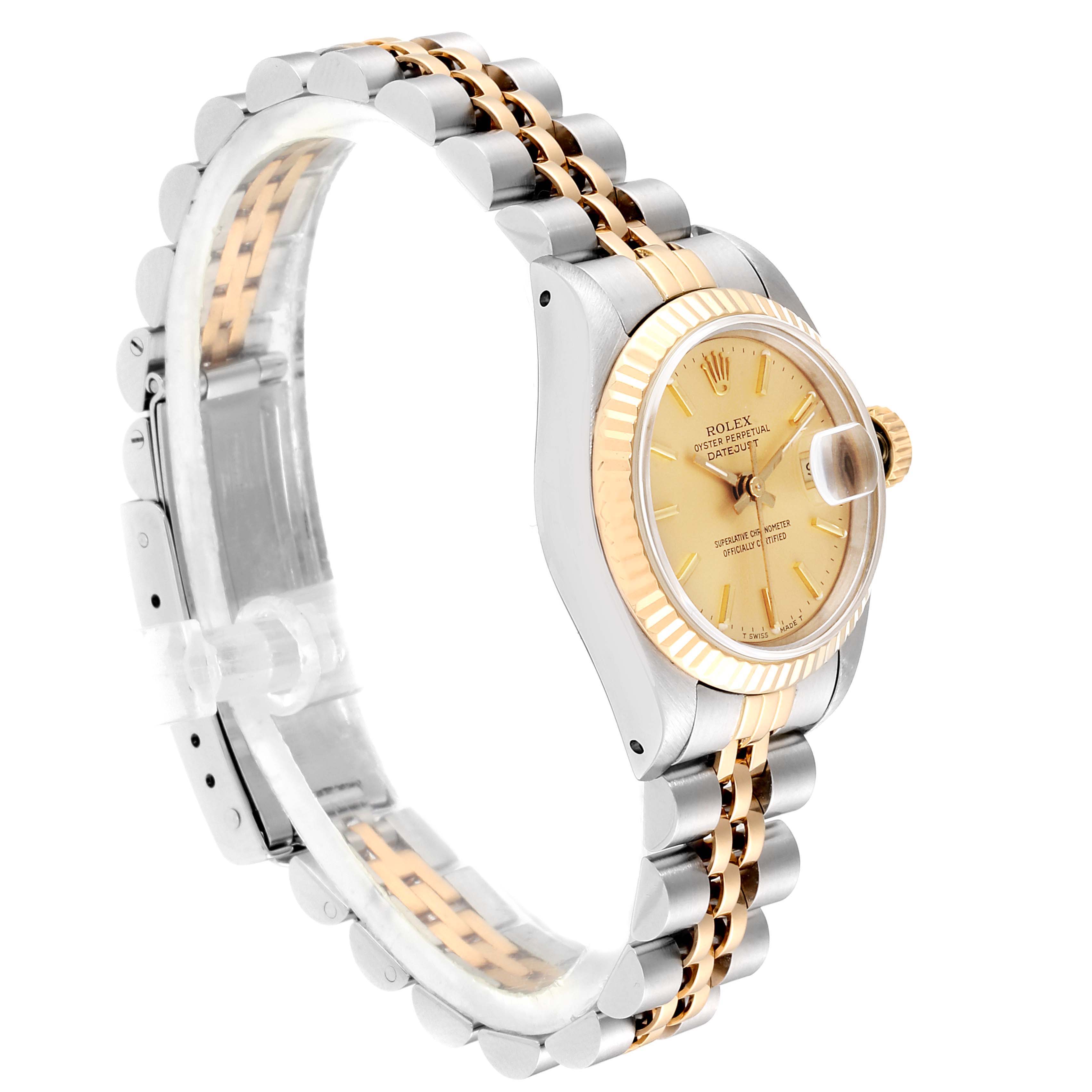 The image shows a Rolex Datejust 69173 Women
s Steel and Gold (two tone) Champagne Dial 69173 Women
s Steel and Gold (two tone) Champagne Dial watch from a side angle, highlighting the gold bezel, face, and two-tone bracelet.