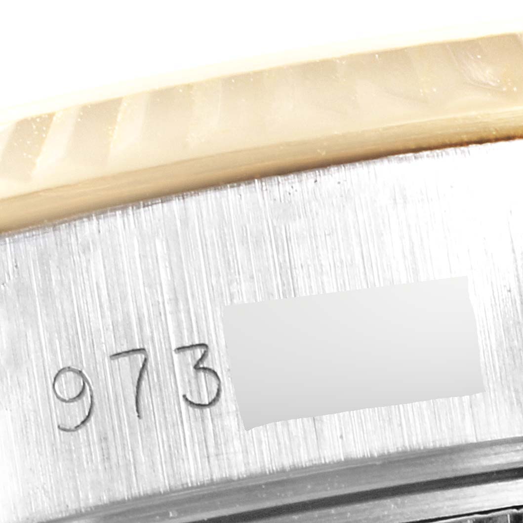 This image shows a close-up of the serial number engraving on the case of a Rolex Datejust 69173 Women
s Steel and Gold (two tone) Champagne Dial 69173 Women
s Steel and Gold (two tone) Champagne Dial watch.