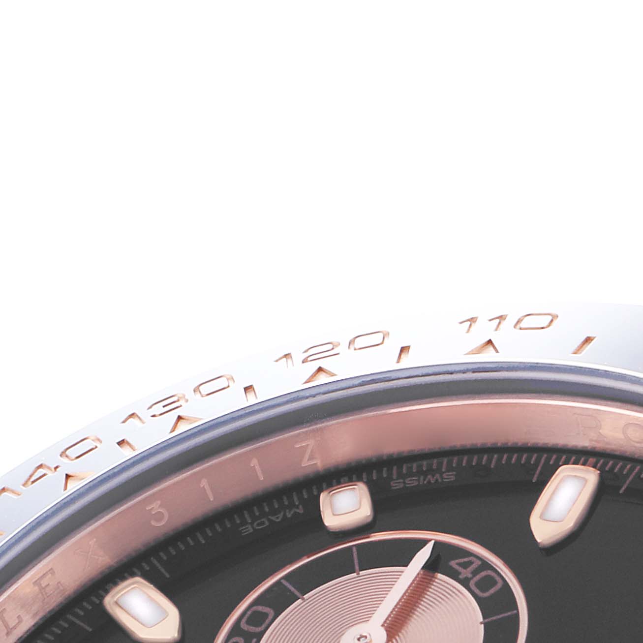 The image shows a close-up of the bezel and part of the dial of a Rolex Daytona 116515 Men
s Rose Gold Black Dial watch.