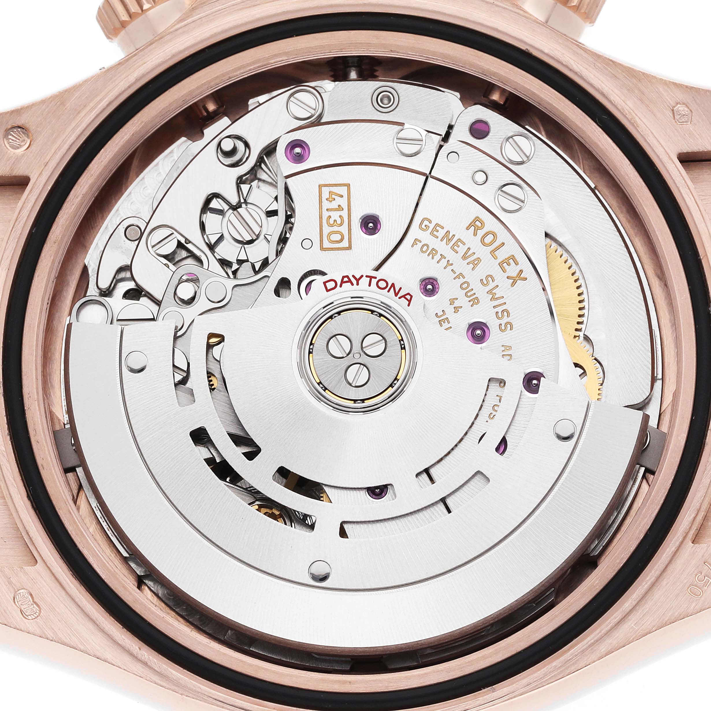 The image shows the movement of a Rolex Daytona 116515 Men
s Rose Gold Black Dial watch from a back angle, highlighting its intricate mechanical parts.