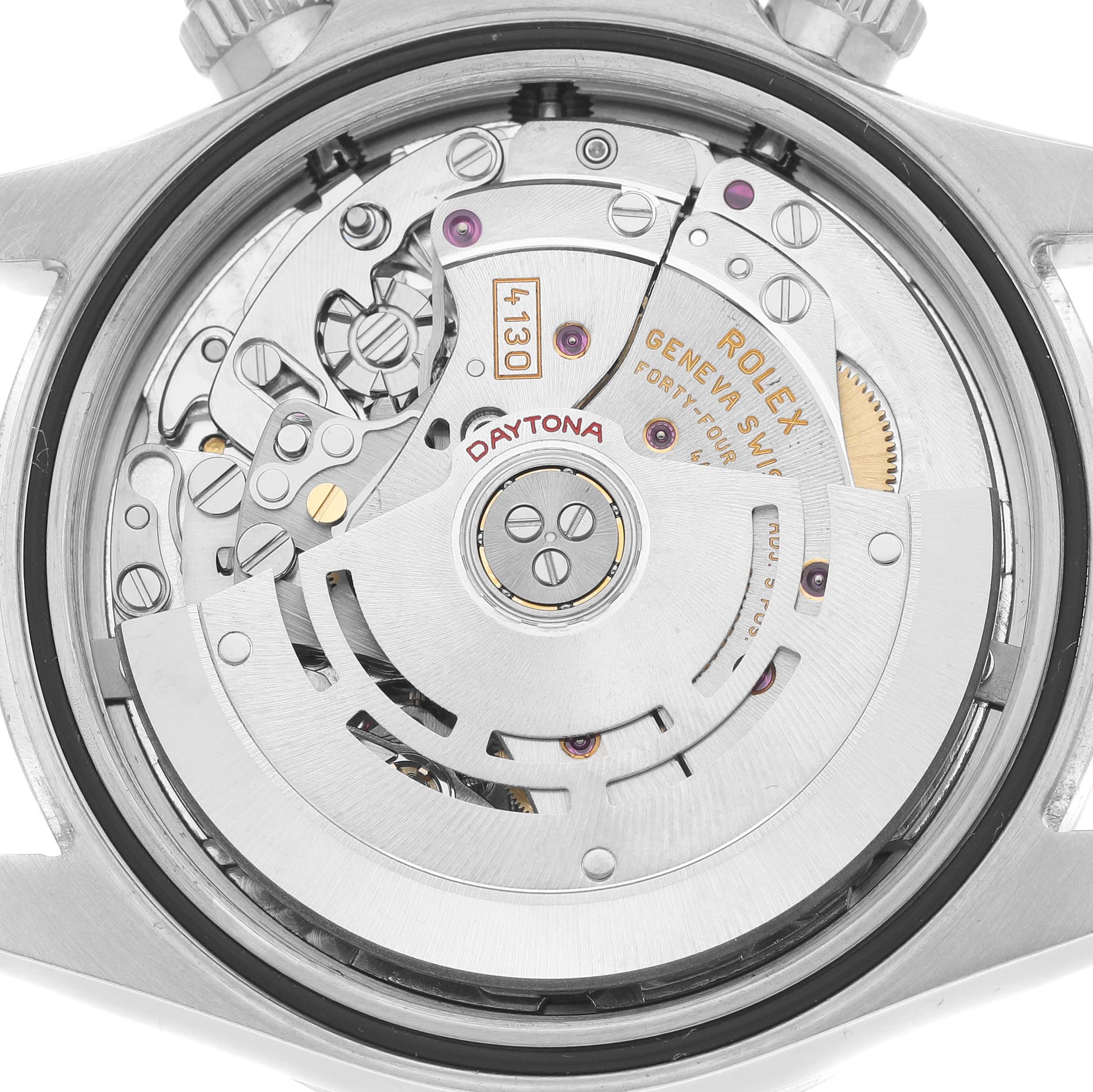 This image shows the movement mechanism of a Rolex Daytona 116520 Men
s Stainless Steel White Dial watch from the back, including gears and the rotor.