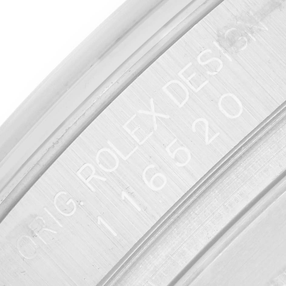 The image shows the engraved inner rim or rehaut of a Rolex Daytona 116520 Men
s Stainless Steel White Dial watch with model number 116520.