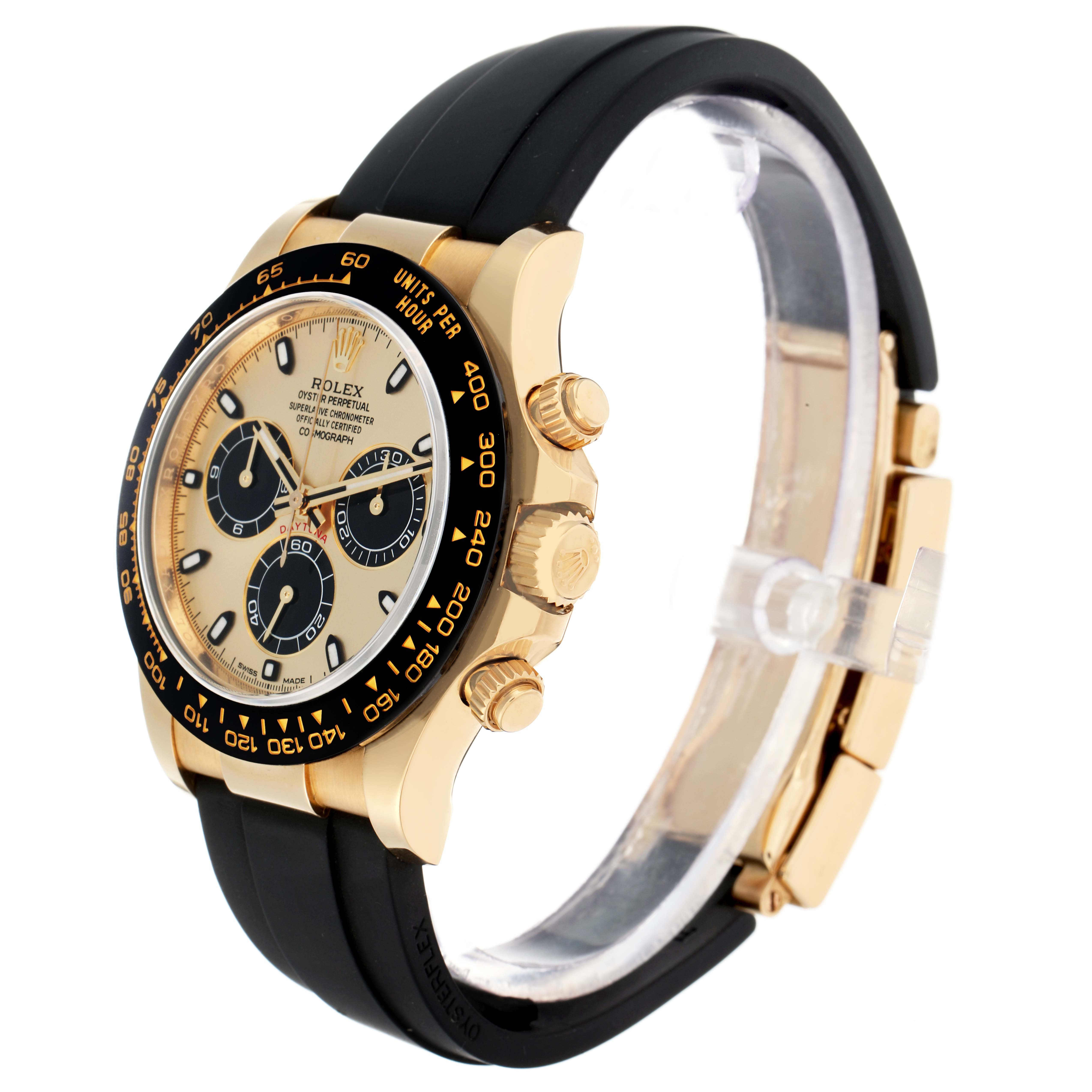 The Rolex Daytona 116518 Men
s Yellow Gold Champagne Dial is shown at a side angle, highlighting the gold case, black bezel, chronograph dials, and rubber strap.