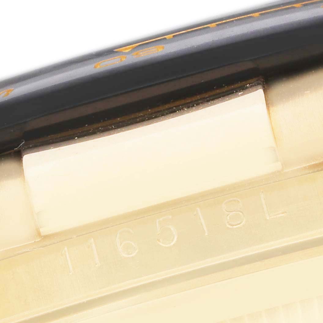 The image shows a close-up of the side of a Rolex Daytona 116518 Men
s Yellow Gold Champagne Dial watch, highlighting the bezel edge and serial number engraving.