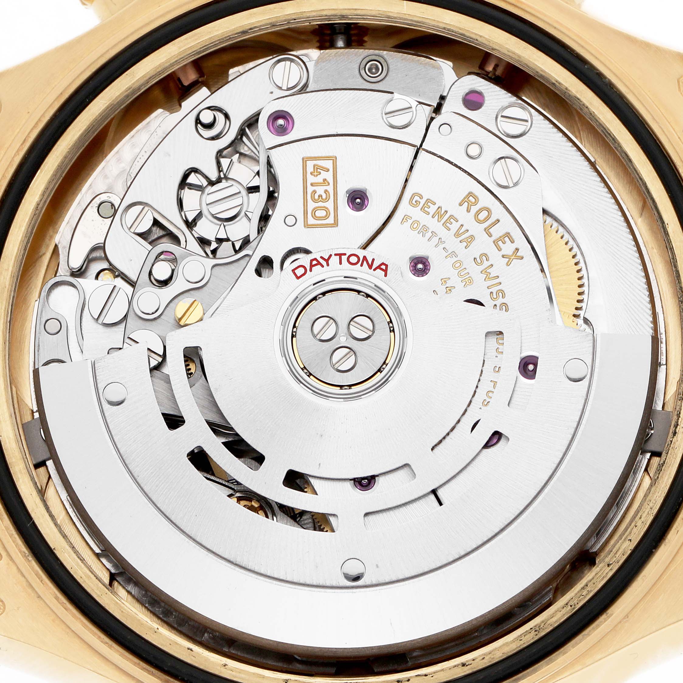 The image shows the movement of a Rolex Daytona 116518 Men
s Yellow Gold Champagne Dial watch from a top-down angle, highlighting its intricate mechanical components.