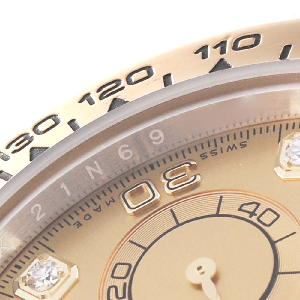 This close-up angle shows the bezel, part of the dial, and diamond markers of the Rolex Daytona 116503 Men's Steel and Gold (two tone) Champagne Dial 116503 Men's Steel and Gold (two tone) Champagne Dial watch.