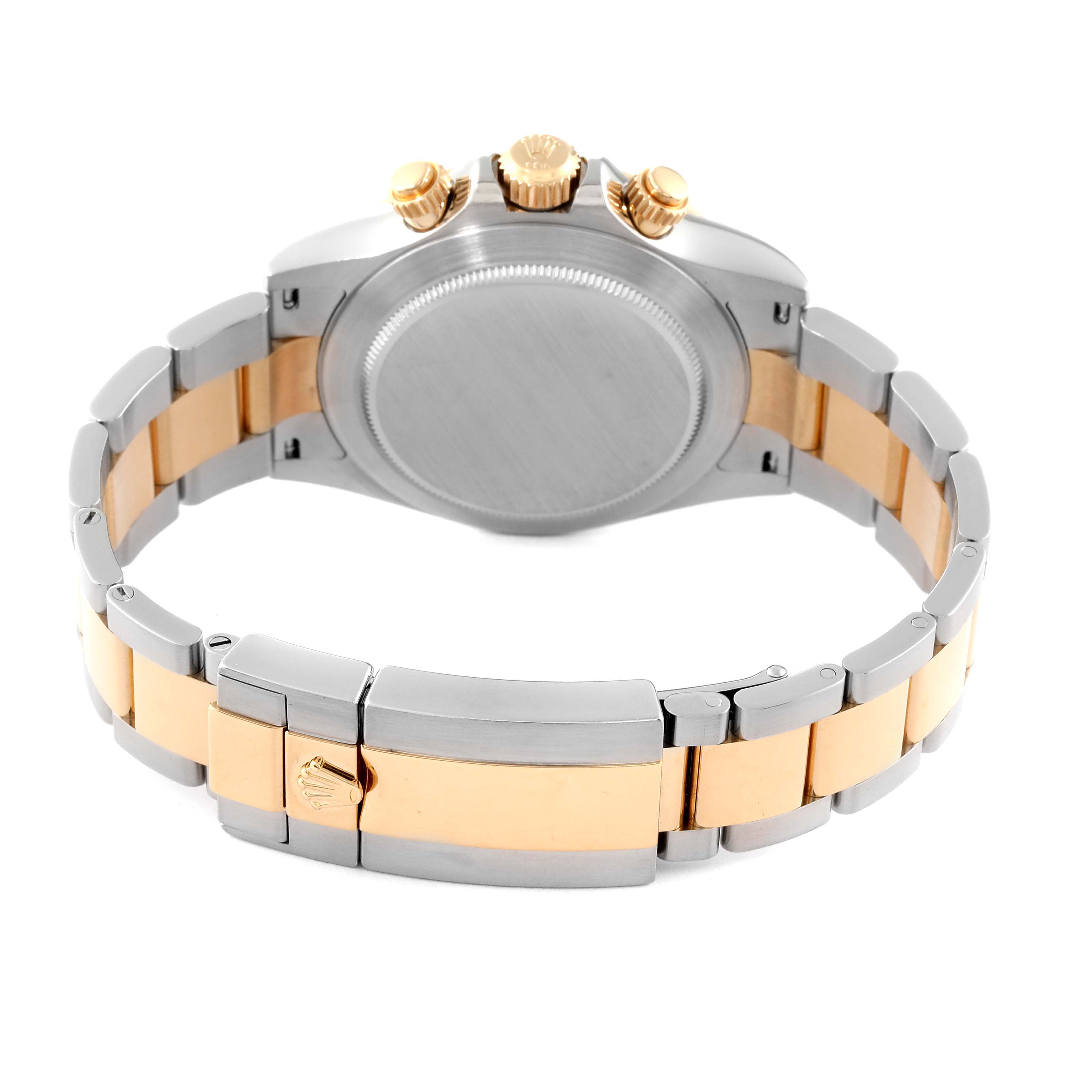 The image shows the back and bracelet of a Rolex Daytona 116503 Men's Steel and Gold (two tone) Champagne Dial 116503 Men's Steel and Gold (two tone) Champagne Dial watch, highlighting its clasp and crown.