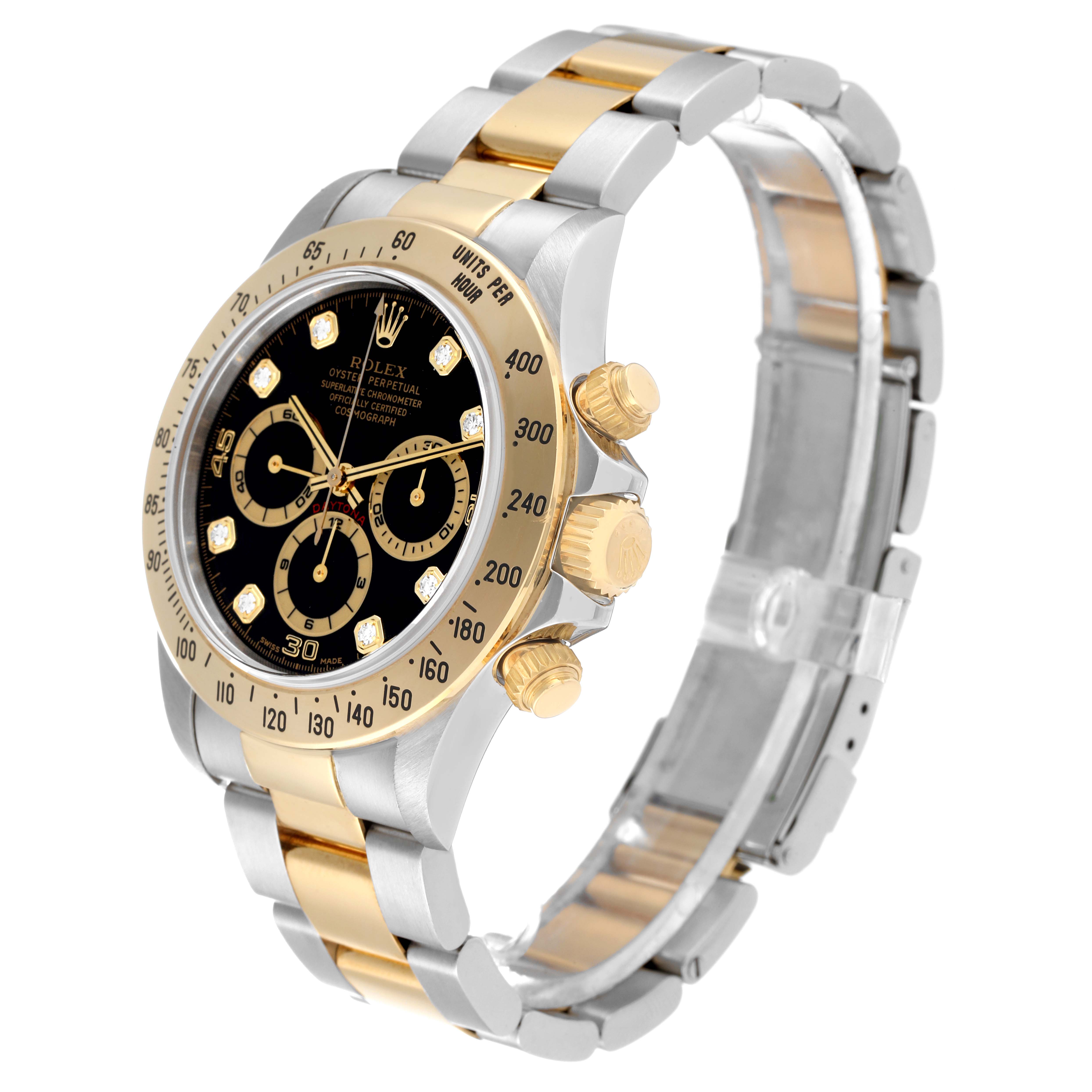 This image shows a Rolex Daytona 16523 Men
s Steel and Gold (two tone) Black Dial 16523 Men
s Steel and Gold (two tone) Black Dial watch at an angle, displaying the dial, bezel, chronograph pushers, and two-tone bracelet.