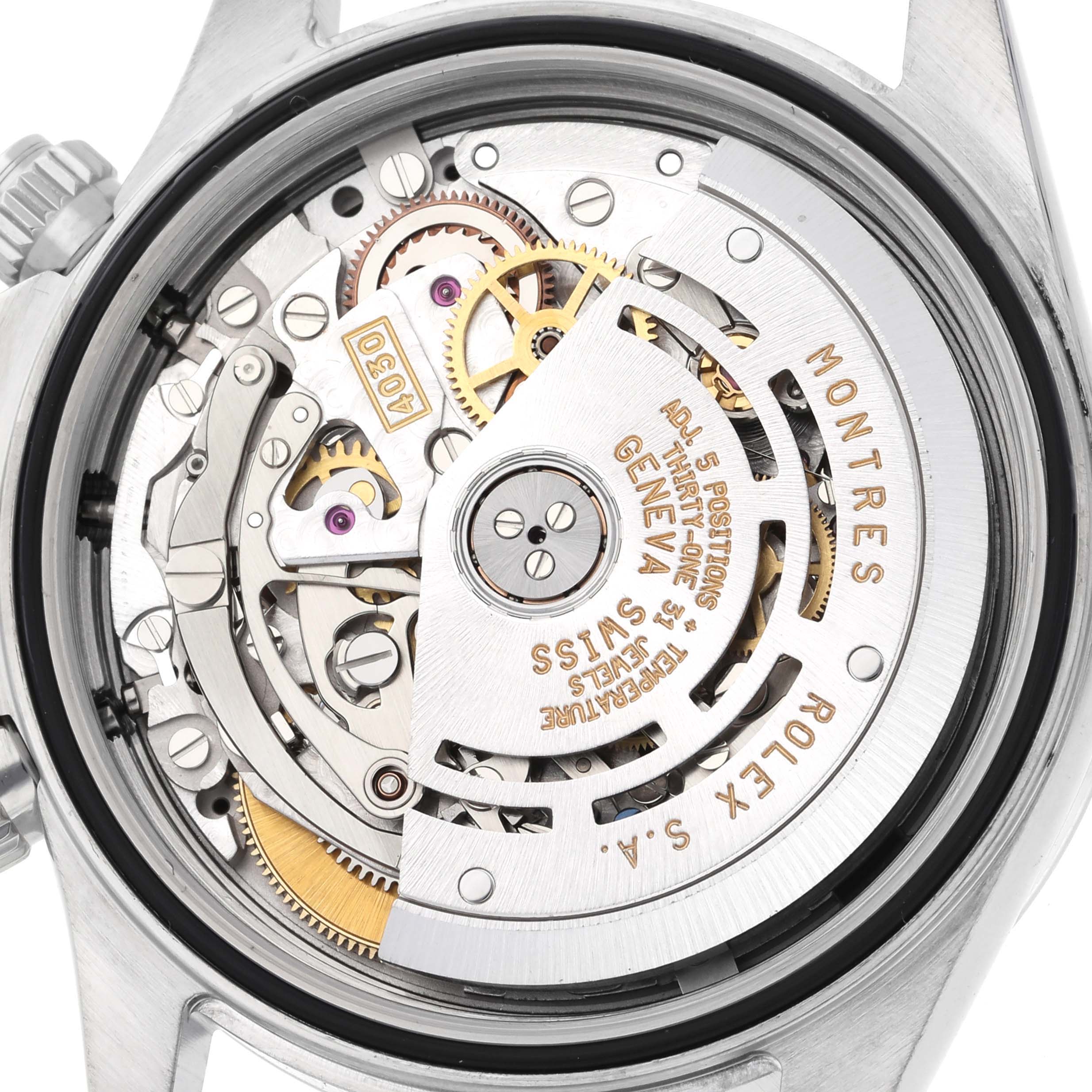 The image shows a close-up of the Rolex Daytona 16520 Men's Stainless Steel Black Dial 16520 Men's Stainless Steel Black Dial watch movement, specifically the intricate gears and rotor.