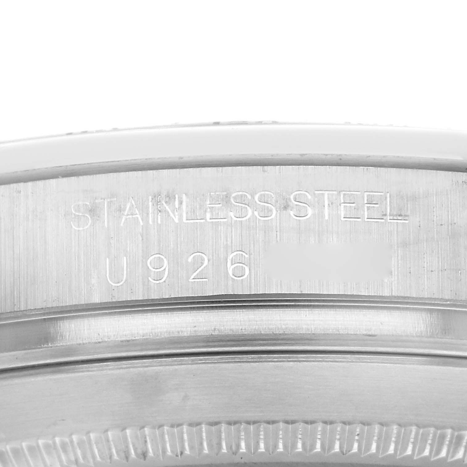 This image shows a close-up of the case back rim with serial engraving of a Rolex Daytona 16520 Men's Stainless Steel Black Dial 16520 Men's Stainless Steel Black Dial model watch.