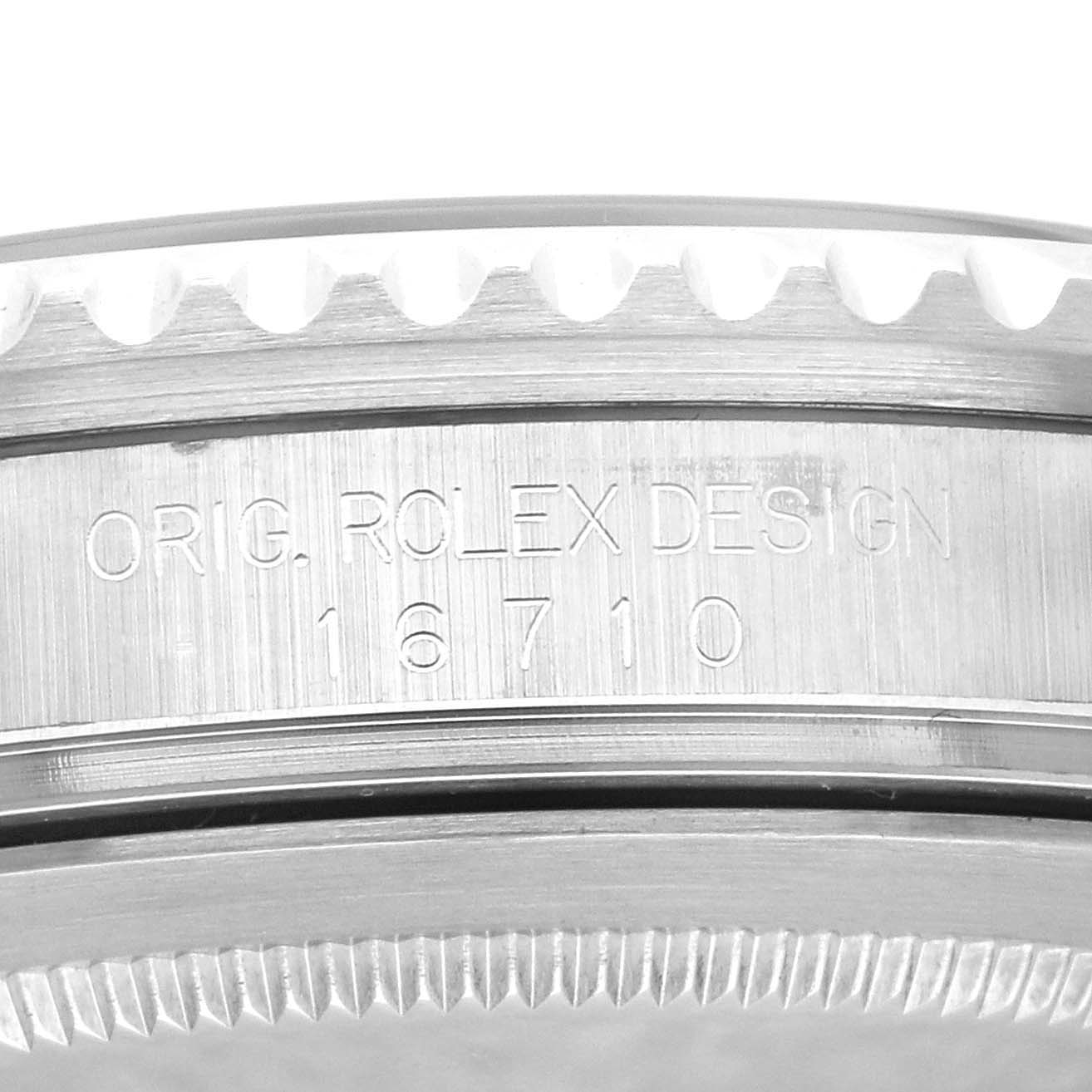 This image shows a close-up of the side of the bezel and case of a Rolex GMT-Master 16710 Men's Stainless Steel Black Dial 16710 Men's Stainless Steel Black Dial model, displaying the model number 16710.