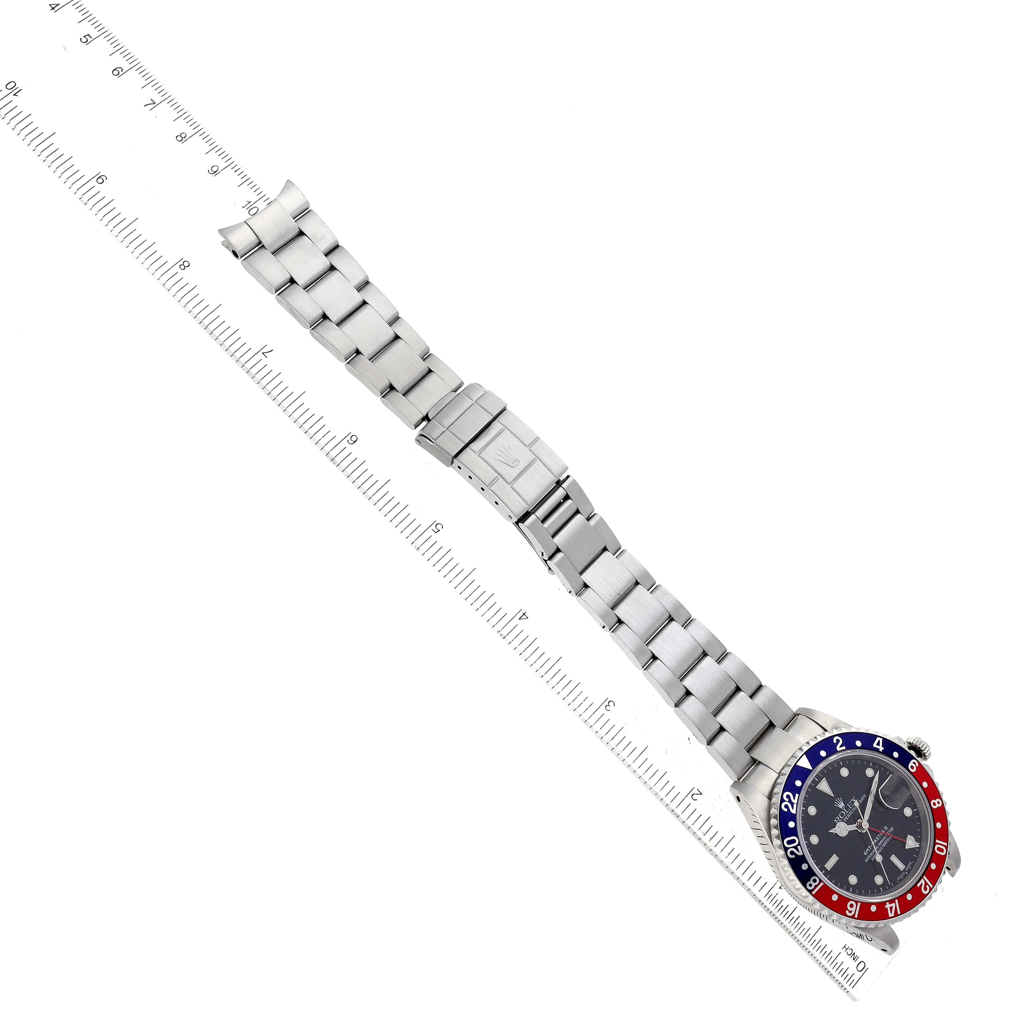 The image shows a top-down view of a Rolex GMT-Master 16710 Men's Stainless Steel Black Dial 16710 Men's Stainless Steel Black Dial watch, highlighting its bracelet and bezel.