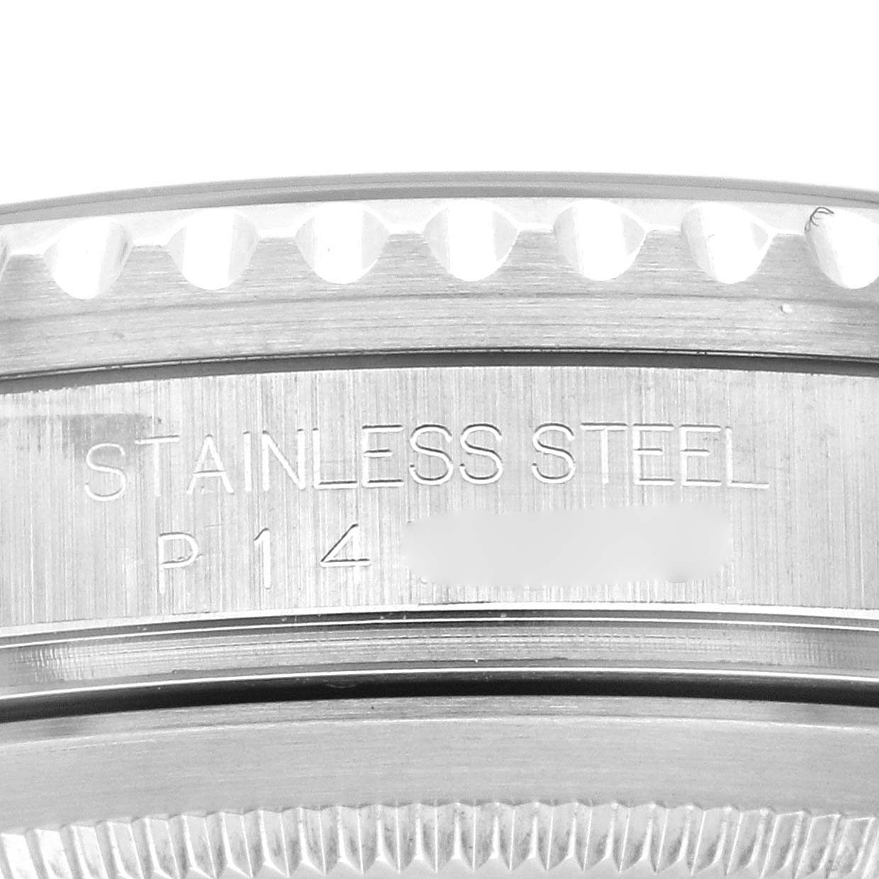 This image shows a close-up of the side of a Rolex GMT-Master 16710 Men's Stainless Steel Black Dial 16710 Men's Stainless Steel Black Dial watch, specifically focusing on the stainless steel case with engraved writing.