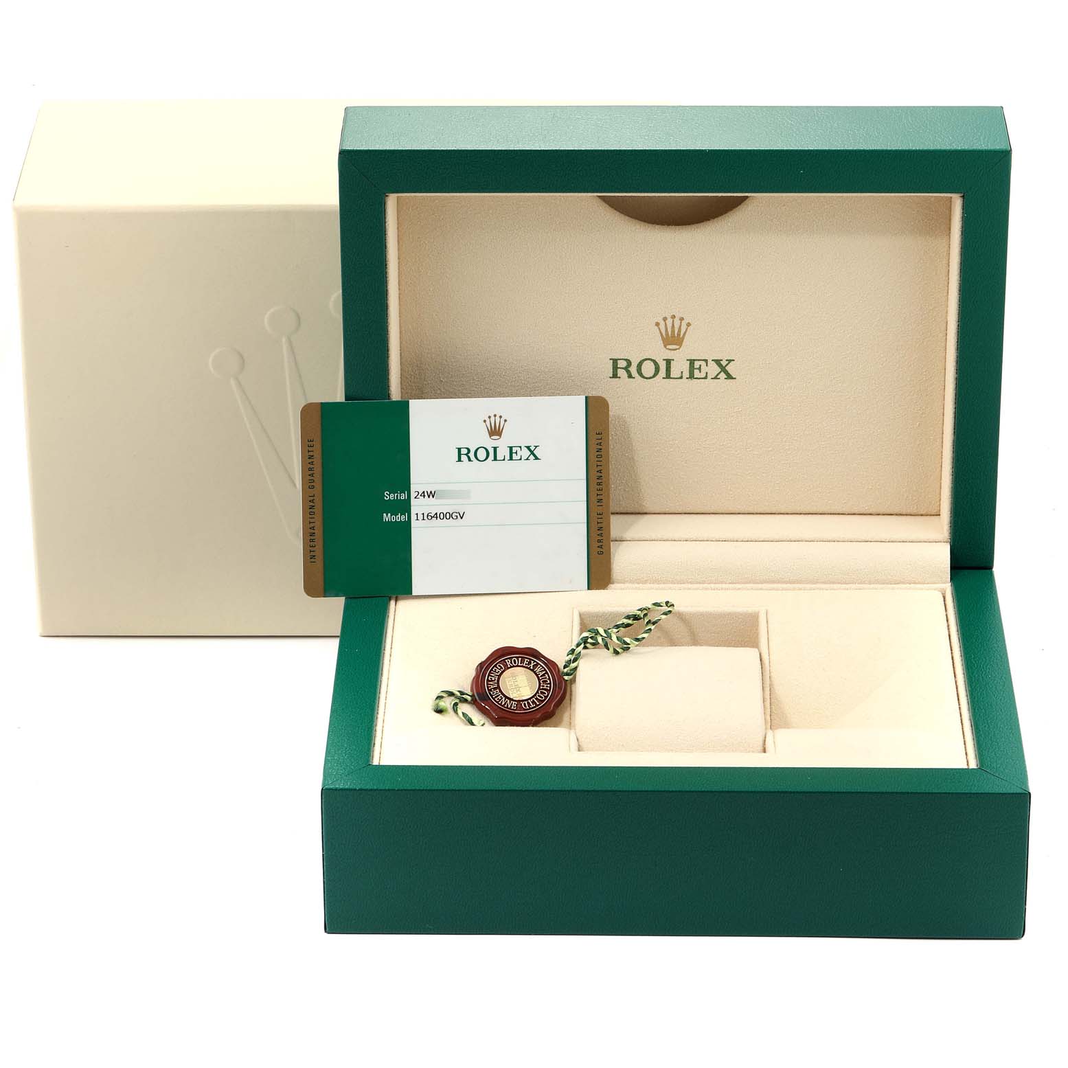 The image shows a green Rolex box for the Milgauss model containing a warranty card and tag, viewed from the front.