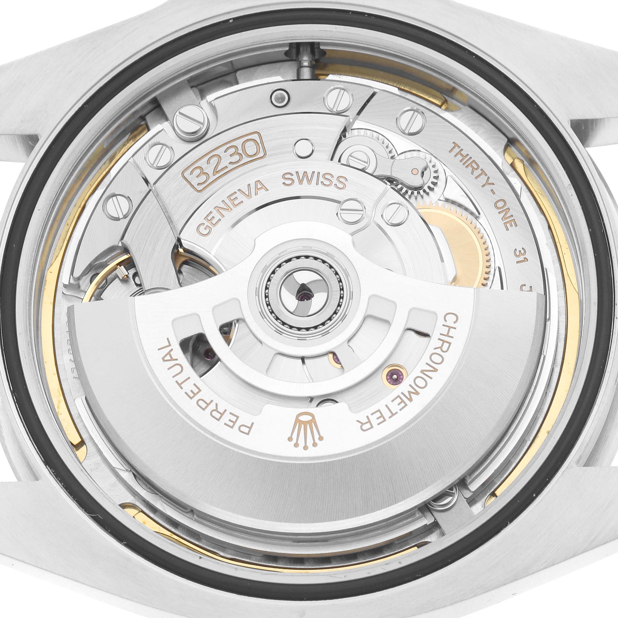 The image shows the open case back view of the Rolex Air-King 126900 Men
s Stainless Steel Black Dial watch, revealing its intricate mechanical movement.