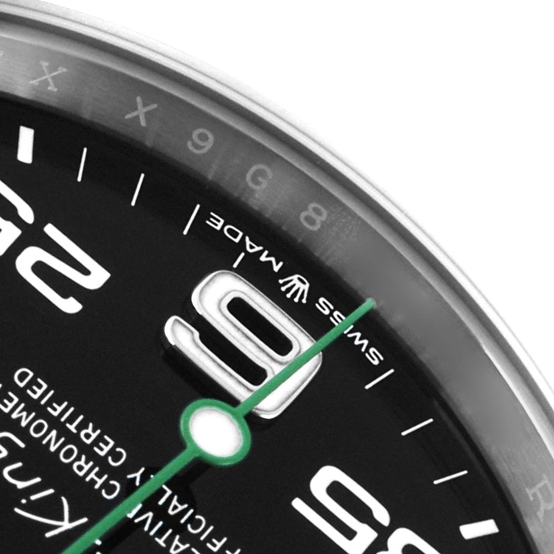 The image shows a close-up of the Rolex Air-King 126900 Men
s Stainless Steel Black Dial watch face, highlighting the 9 o
clock marker, bezel, and "Swiss Made" text.