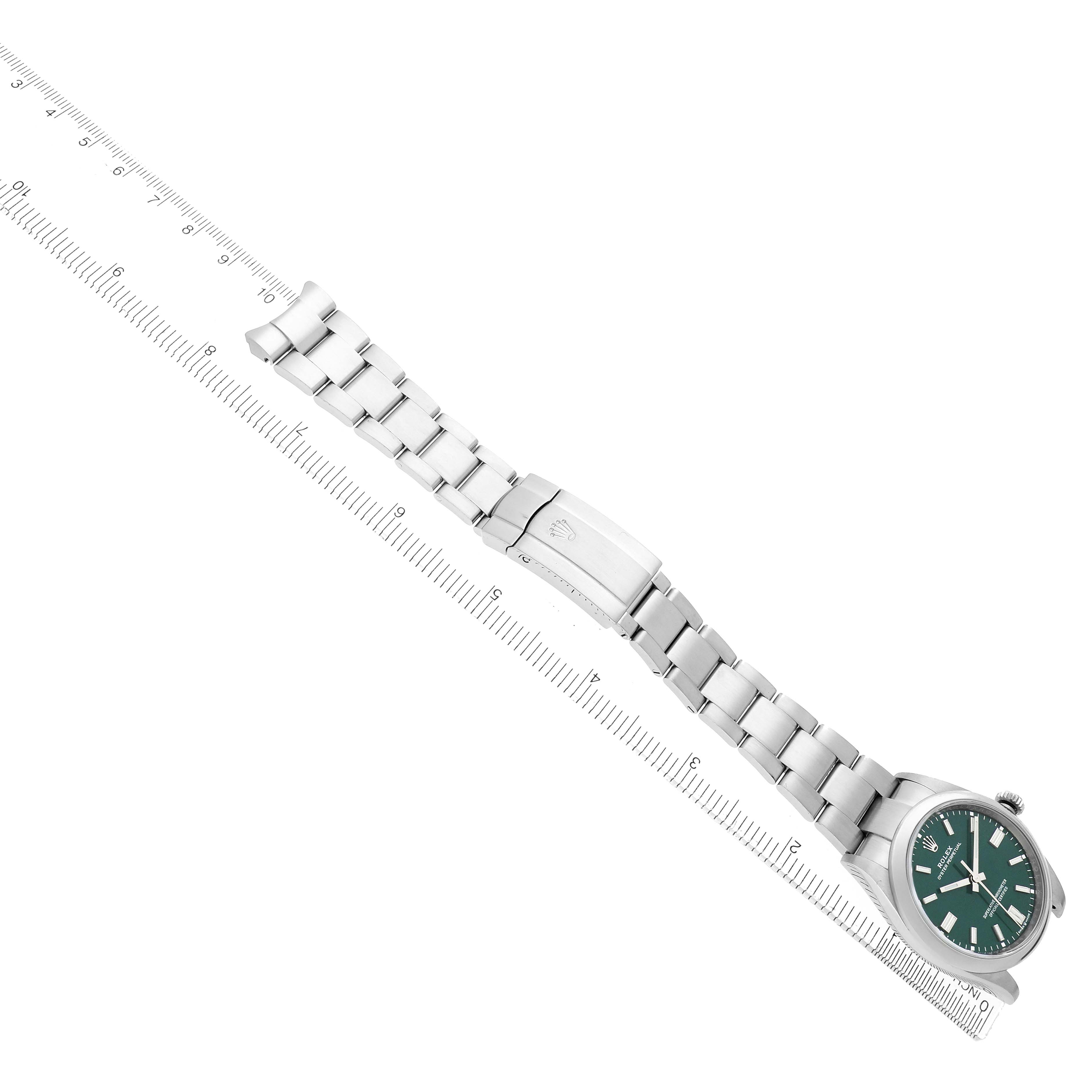The Rolex Oyster Perpetual 126000 Men
s Stainless Steel Green Dial watch is shown at an oblique angle, displaying the watch face, bracelet, and clasp.