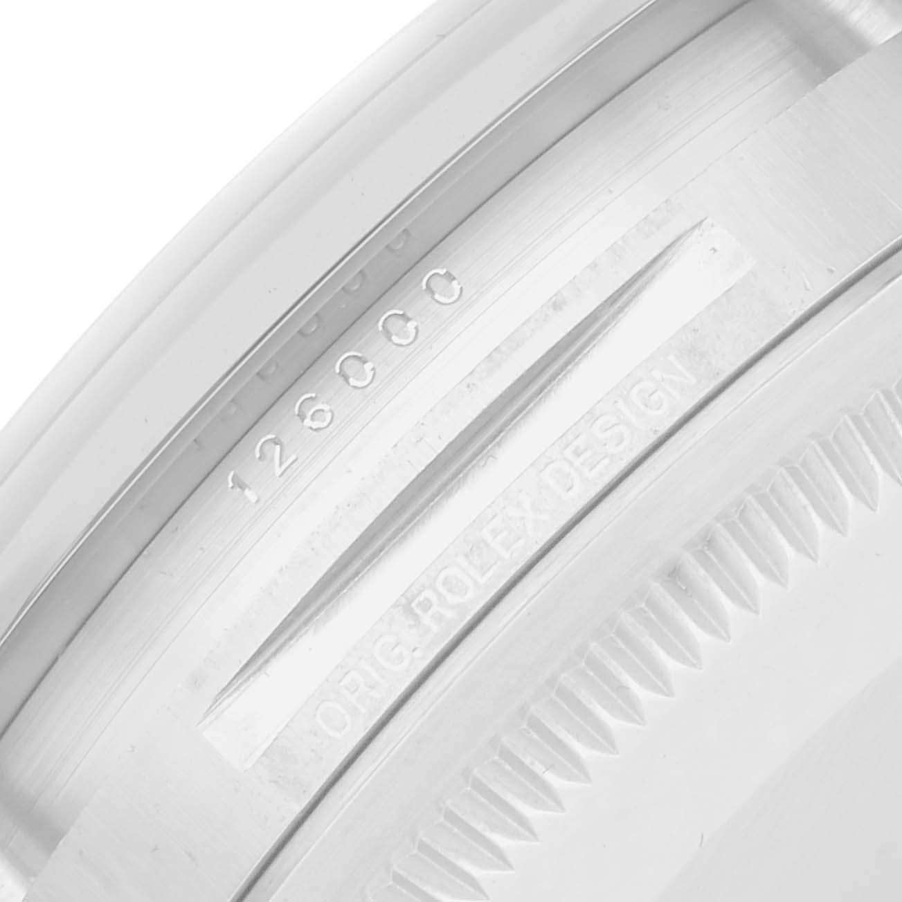 The image shows a close-up of the side engraving on a Rolex Oyster Perpetual 126000 Men
s Stainless Steel Green Dial, highlighting the model number and design etching.