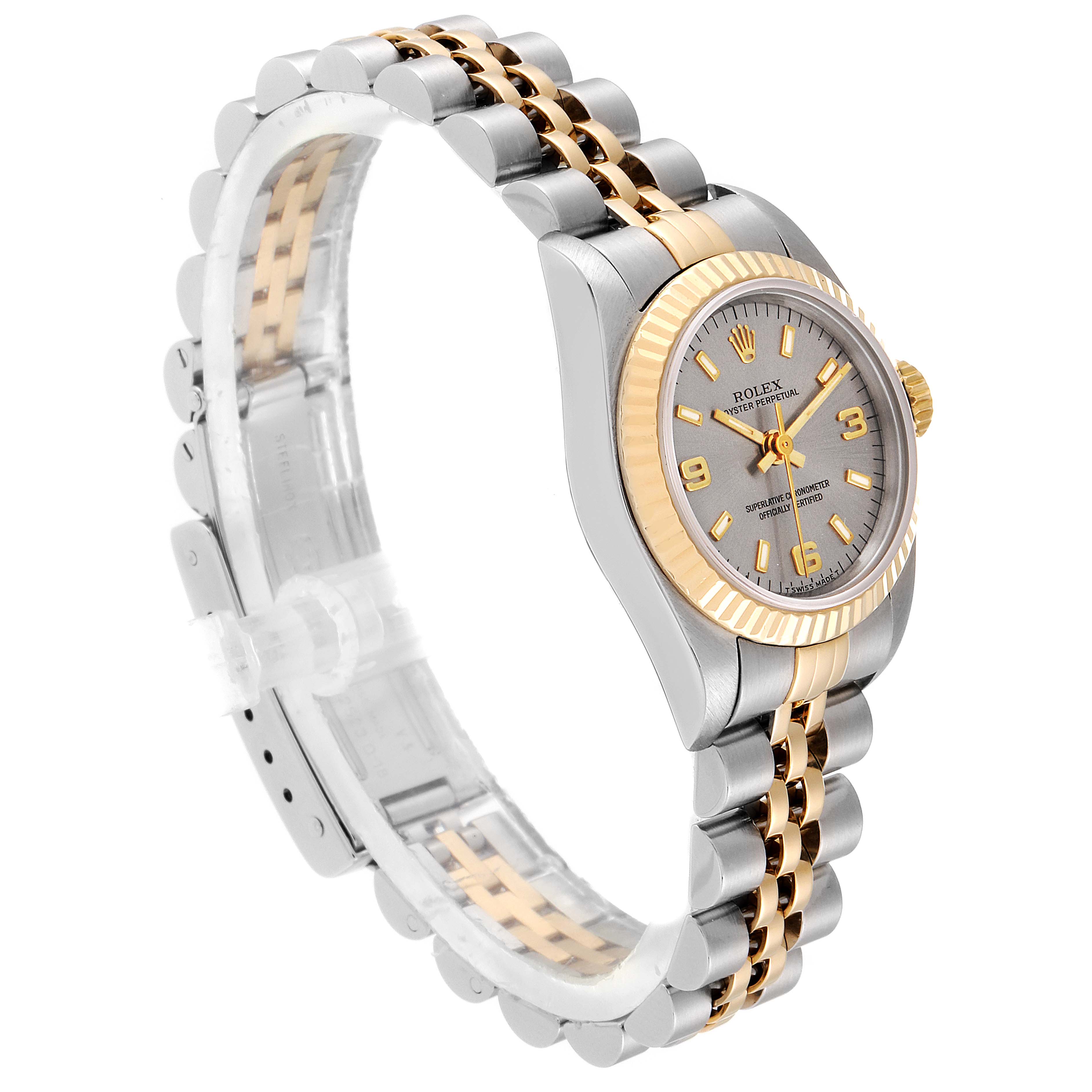 The Rolex Oyster Perpetual 67193 Women's Steel and Gold (two tone) Grey Dial 67193 Women's Steel and Gold (two tone) Grey Dial watch is shown at a slight angle, highlighting its face, bezel, and two-tone bracelet.