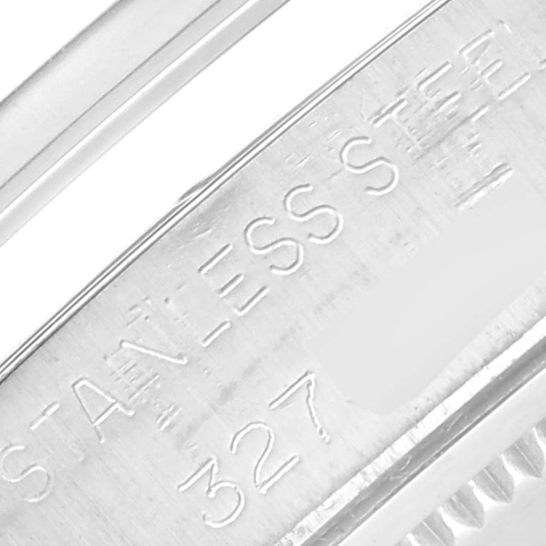 This close-up shows the side engraving on a Vintage Collection model by Rolex, highlighting the "STAINLESS STEEL" inscription.