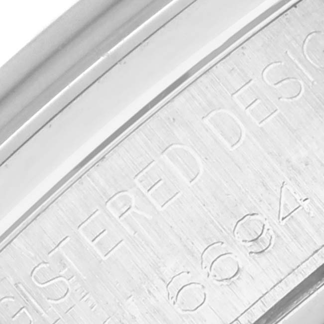 This image shows a close-up of the engraved case back or inner bezel of the Rolex Vintage Collection 6694 Men's Stainless Steel Blue Dial 6694 Men's Stainless Steel Blue Dial watch.