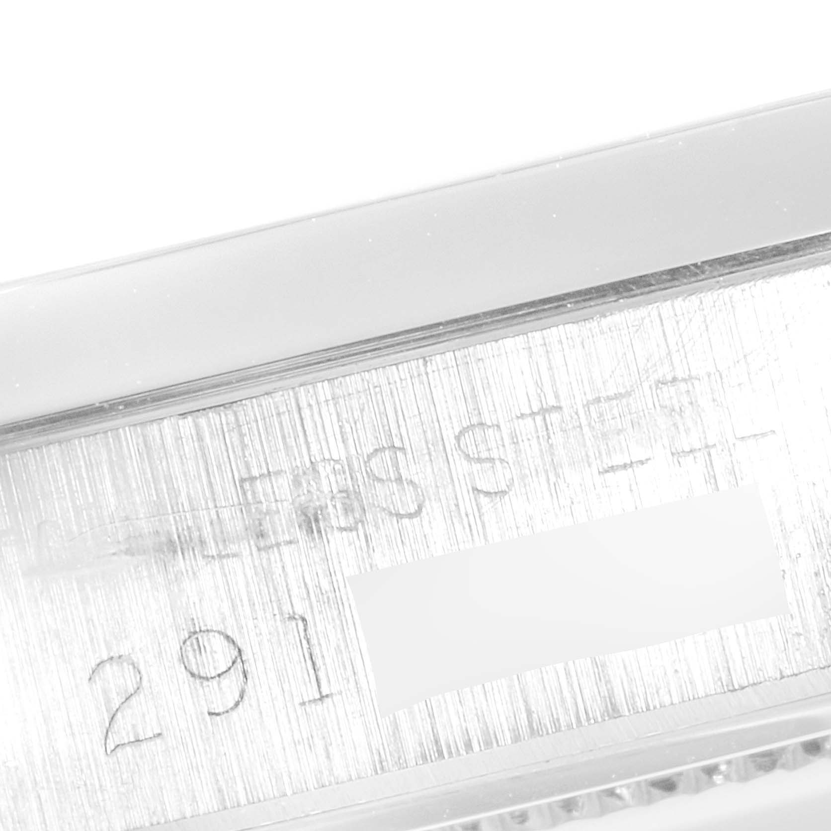 This image shows a close-up of the side of a Vintage Collection Rolex watch case, featuring engraved text.