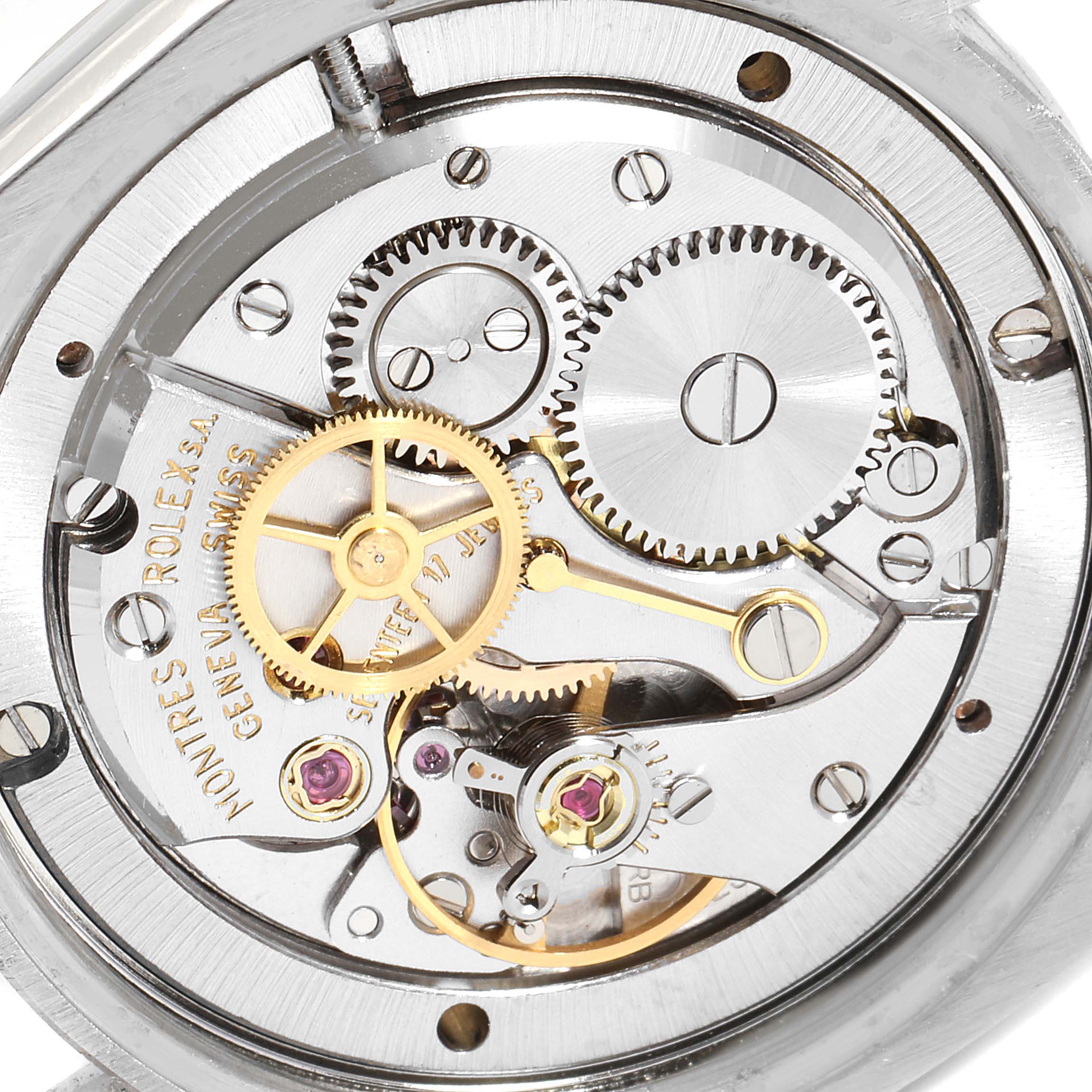 The image shows the internal mechanism and intricate gears of a Rolex Vintage Collection 6694 Men's Stainless Steel Silver Dial 6694 Men's Stainless Steel Silver Dial watch, viewed from a close-up angle.