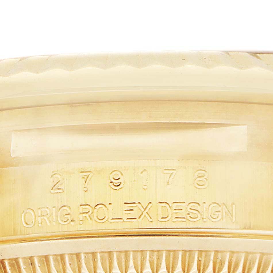 The image shows the inner bezel of a Rolex President 279178 Women
s Yellow Gold Silver Dial watch with engraved model details.