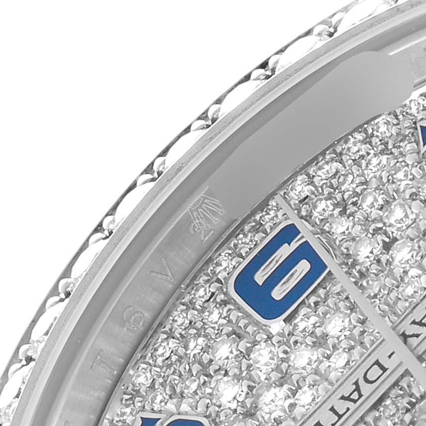 The image shows a close-up of a Rolex President 118346 Men
s Platinum Silver Dial watch
s diamond-encrusted dial and partial bezel at an angle.