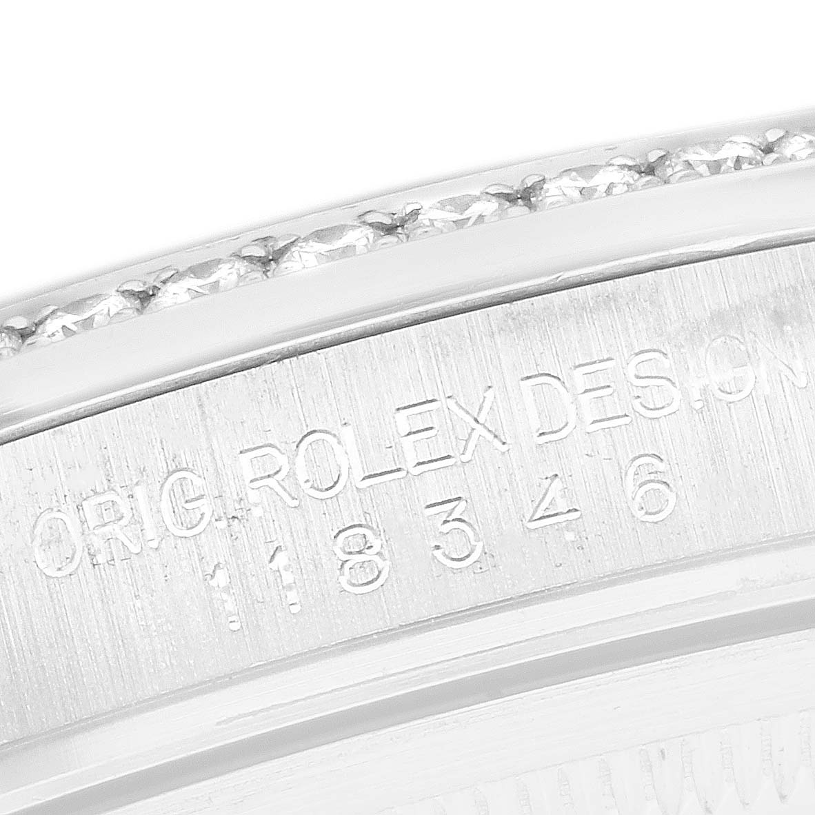 This close-up shows the side engraving with the model number on the Rolex President 118346 Men
s Platinum Silver Dial watch case.