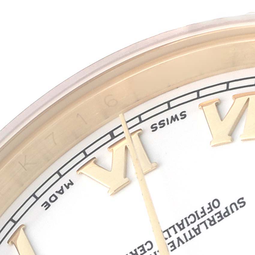 The image shows a close-up of the dial
s edge of a Rolex President 118238 Men
s Yellow Gold White Dial watch, highlighting the Roman numerals and minute markers.