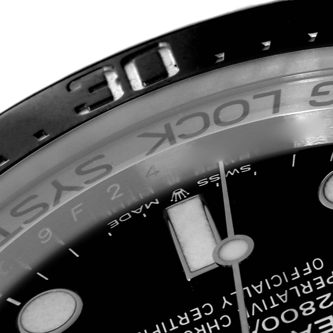 This close-up image of a Rolex Sea-Dweller 126660 Men
s Stainless Steel Black Dial 126660 Men
s Stainless Steel Black Dial watch shows part of the dial, the bezel, and the inscriptions on the chapter ring.