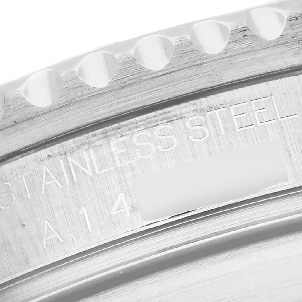 The close-up image shows the stainless steel bezel and part of the engravings on a Rolex Submariner 16610 Men's Stainless Steel Black Dial 16610 Men's Stainless Steel Black Dial watch.