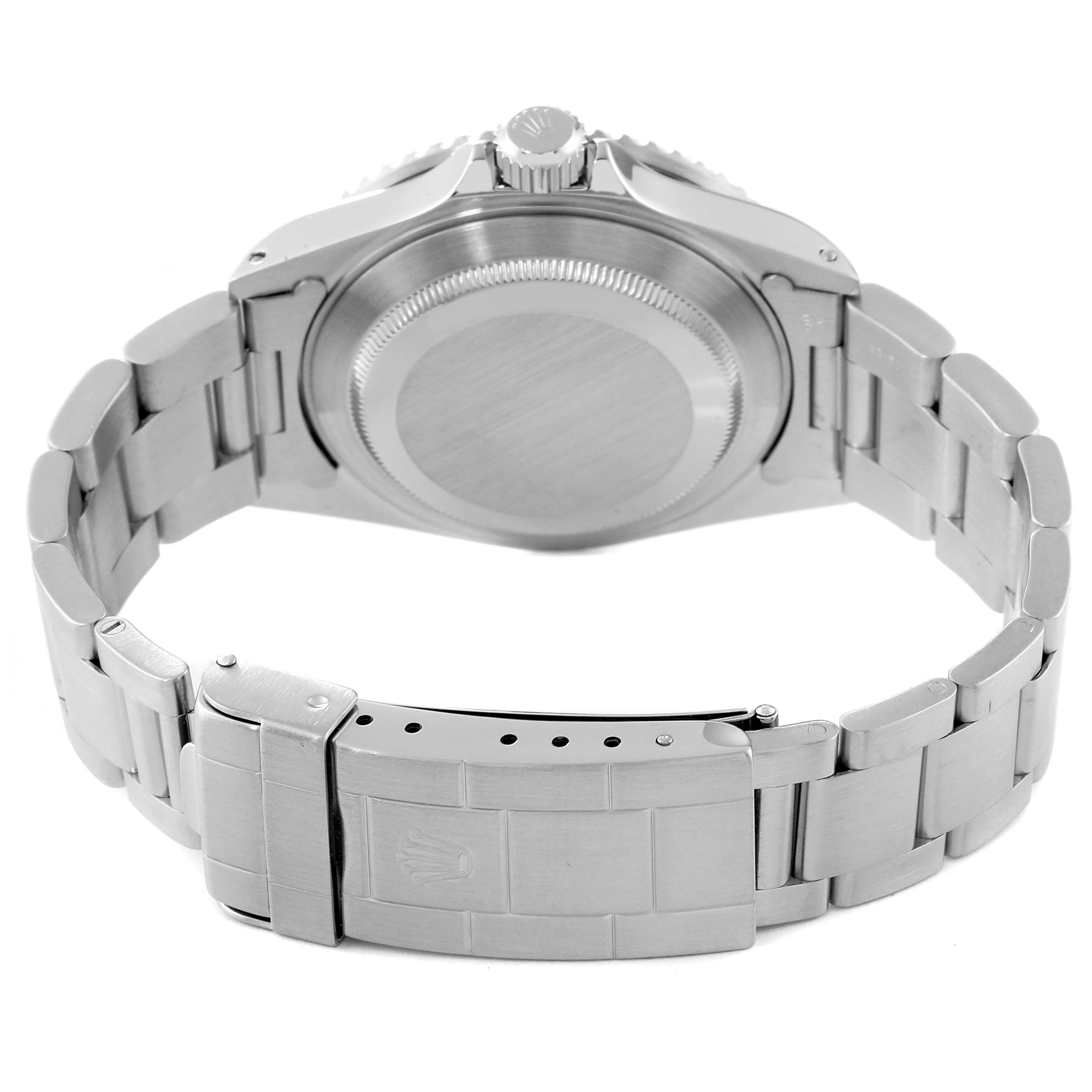 This image shows the back view of the Rolex Submariner 16610 Men's Stainless Steel Black Dial 16610 Men's Stainless Steel Black Dial, focusing on the case back and the bracelet with its clasp.