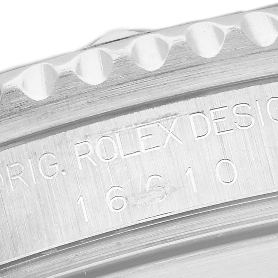This close-up image shows the side engraving of a Rolex Submariner 16610 Men's Stainless Steel Black Dial 16610 Men's Stainless Steel Black Dial watch, highlighting the bezel and model number.