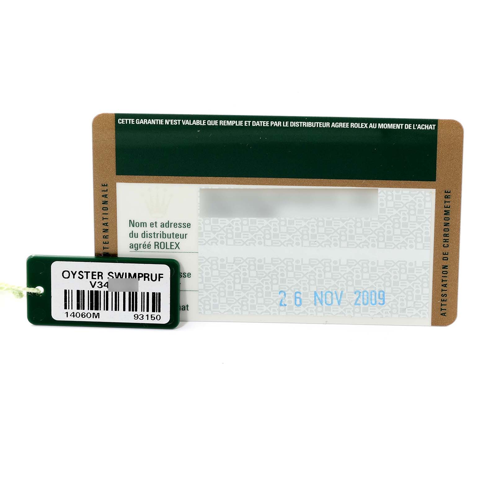 The image shows a Rolex Submariner 14060M Men
s Stainless Steel Black Dial 14060M Men
s Stainless Steel Black Dial warranty card along with an Oyster Swimpruf tag.