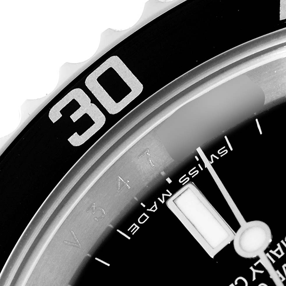 The image shows a close-up of the bezel and part of the dial and hands of a Rolex Submariner 14060M Men
s Stainless Steel Black Dial 14060M Men
s Stainless Steel Black Dial, with "30" on the bezel and "Swiss made" on the dial.