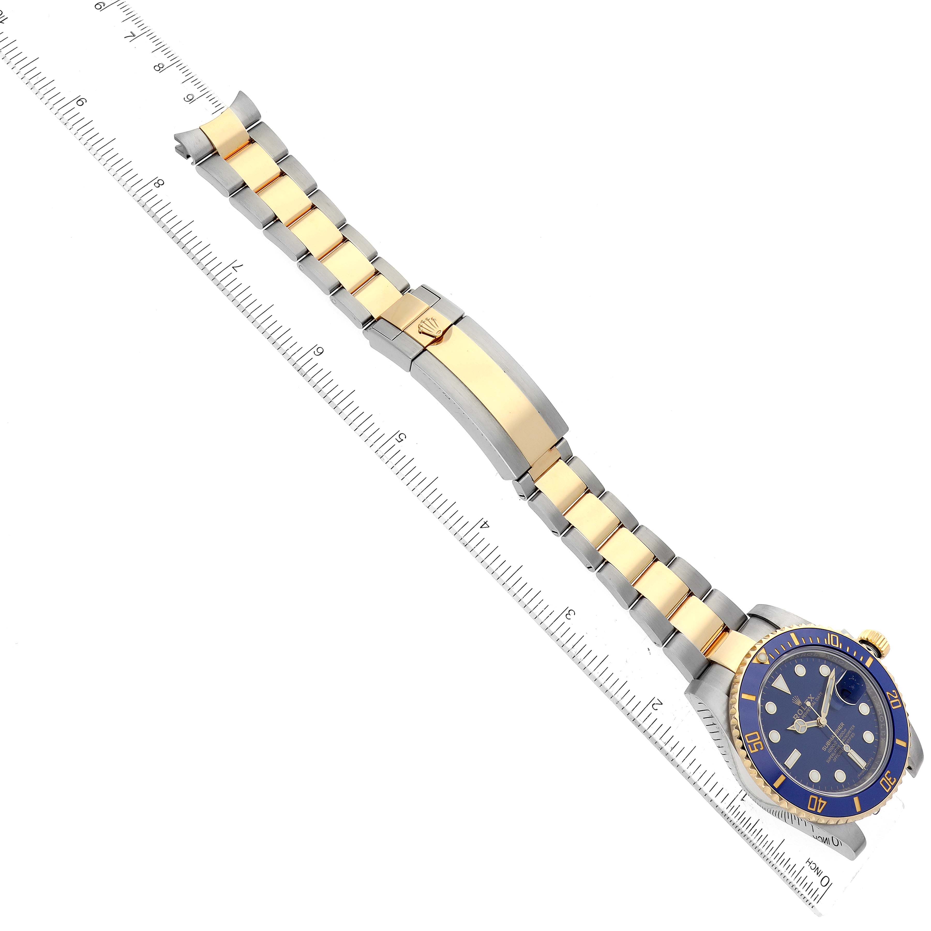 This image shows a side view of a Rolex Submariner 116613 Men's Steel and Gold (two tone) Blue Dial 116613 Men's Steel and Gold (two tone) Blue Dial watch, highlighting the two-tone bracelet, clasp, and blue dial.
