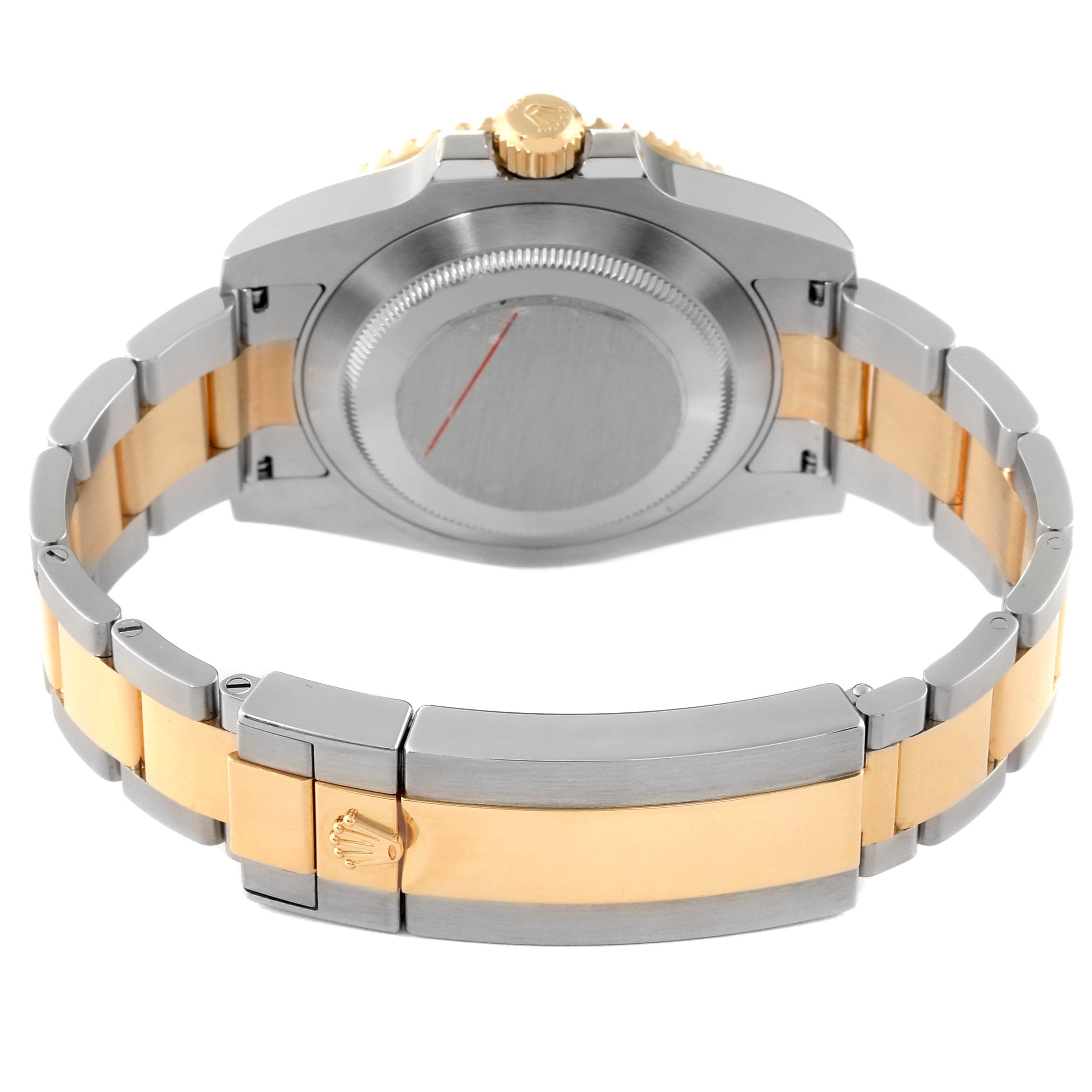 This image shows the backside and bracelet clasp of a Rolex Submariner 116613 Men's Steel and Gold (two tone) Blue Dial 116613 Men's Steel and Gold (two tone) Blue Dial watch, revealing its two-tone metal design.